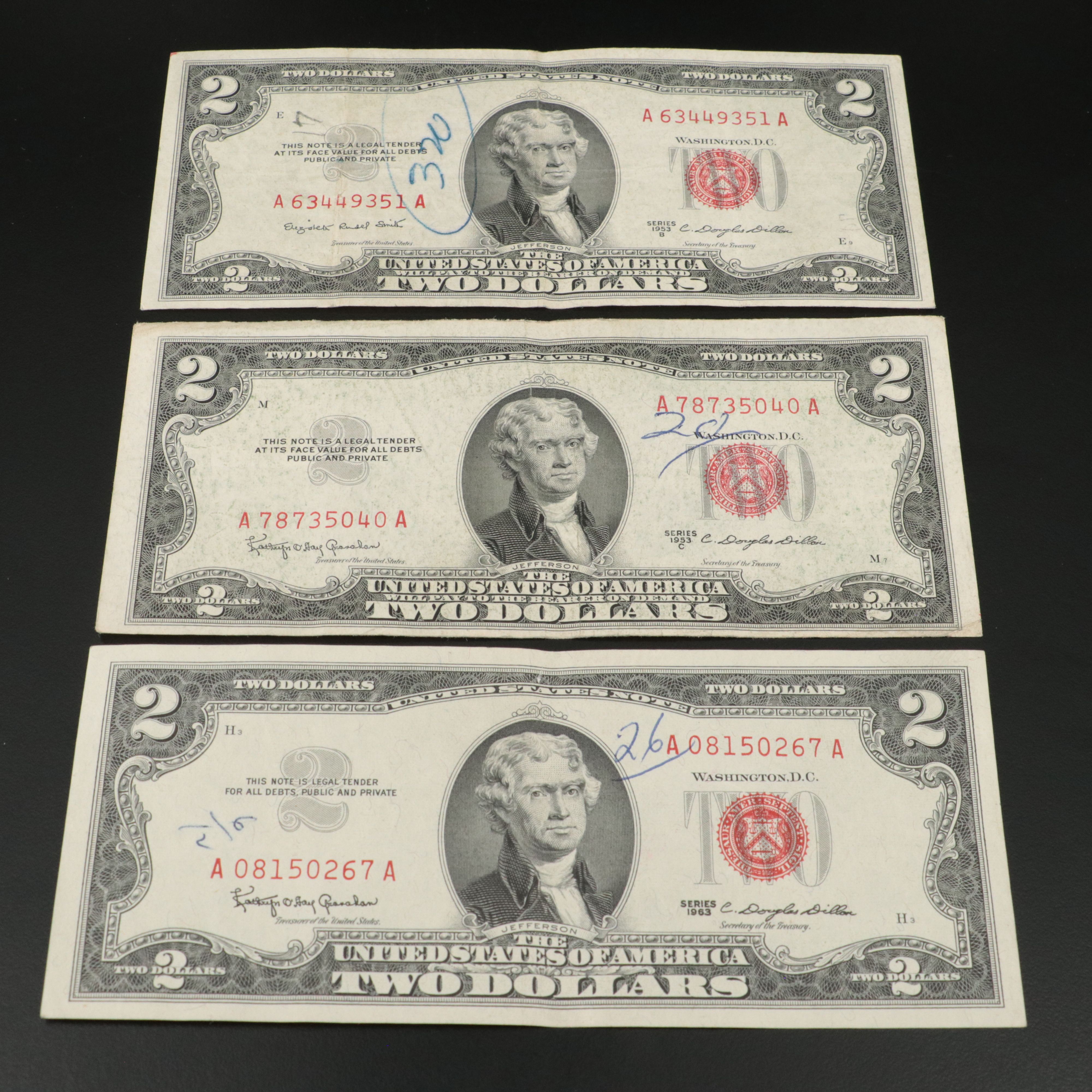 Sixteen U.S. Currency Notes with Writing on Them