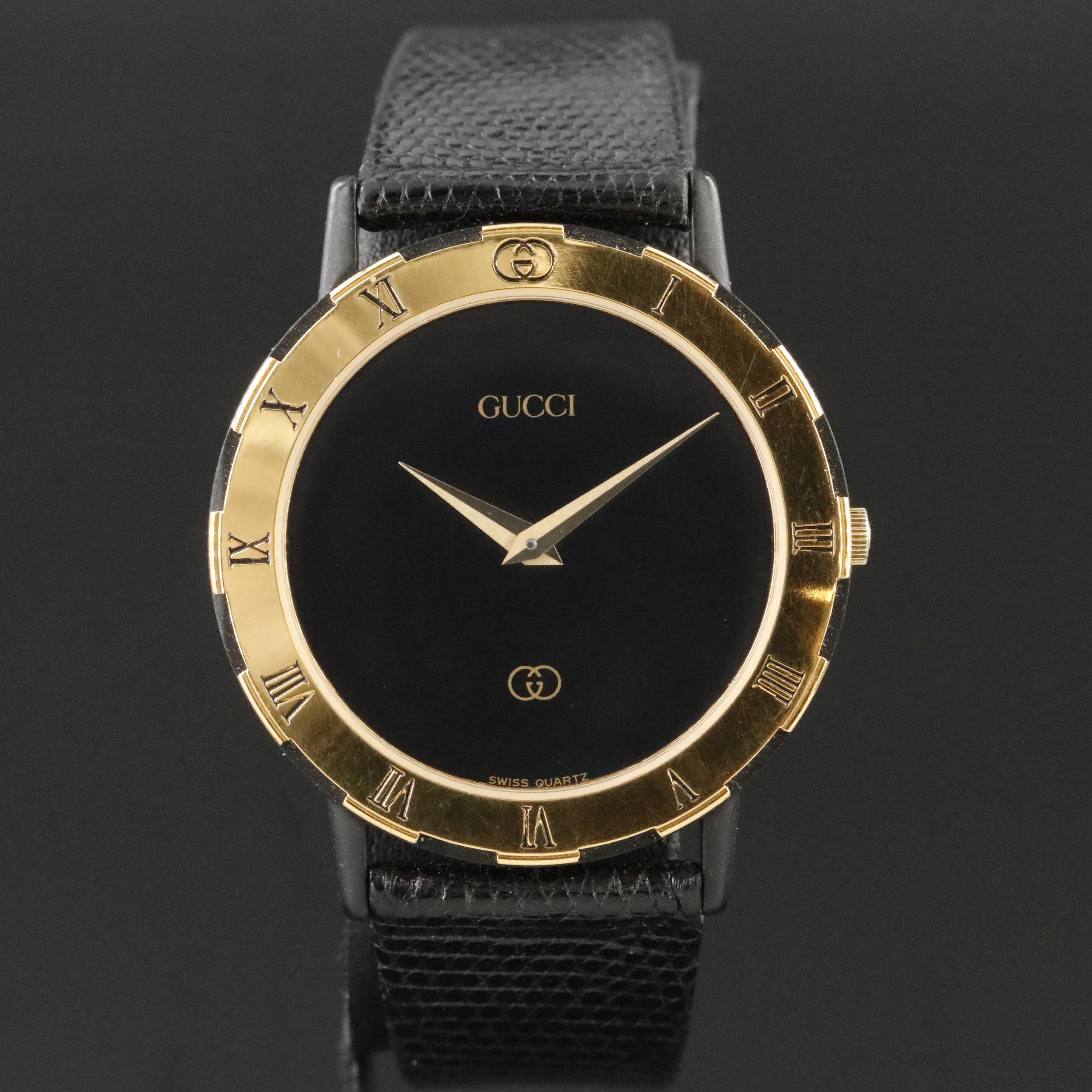 Gucci Black Dial Gold Tone Bezel Watch