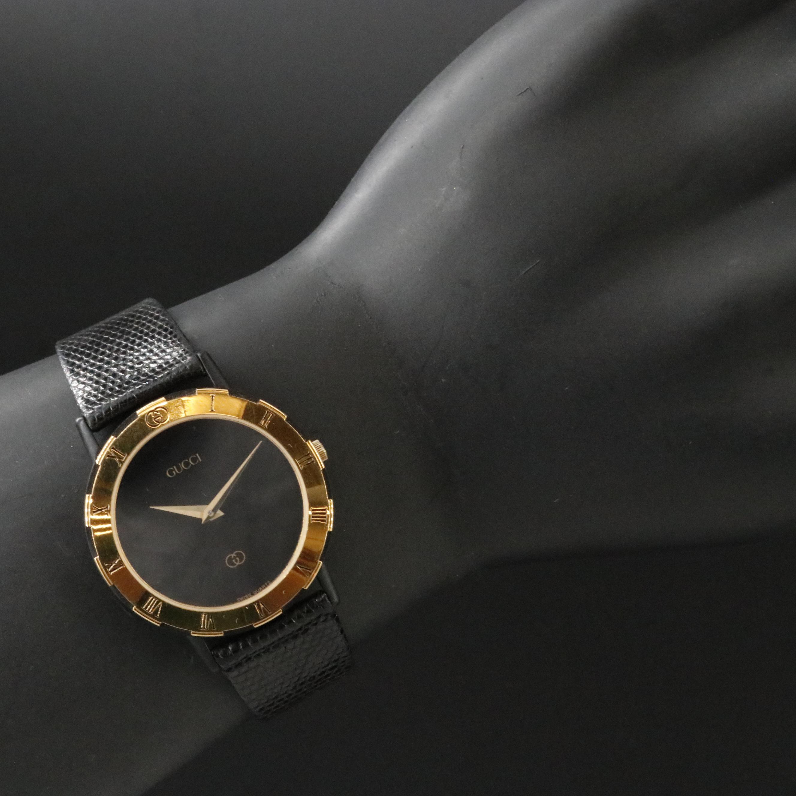 Gucci Black Dial Gold Tone Bezel Watch