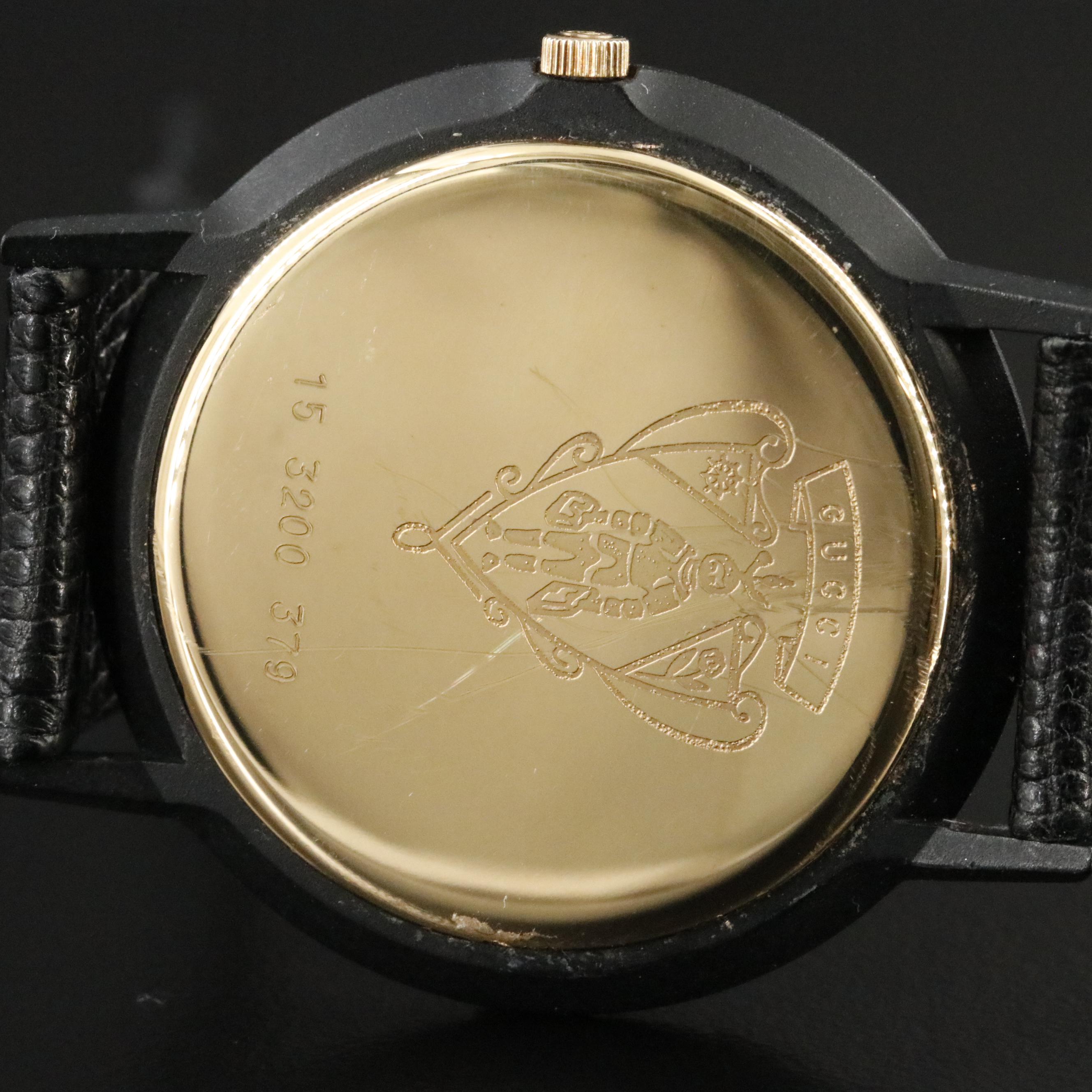 Gucci Black Dial Gold Tone Bezel Watch