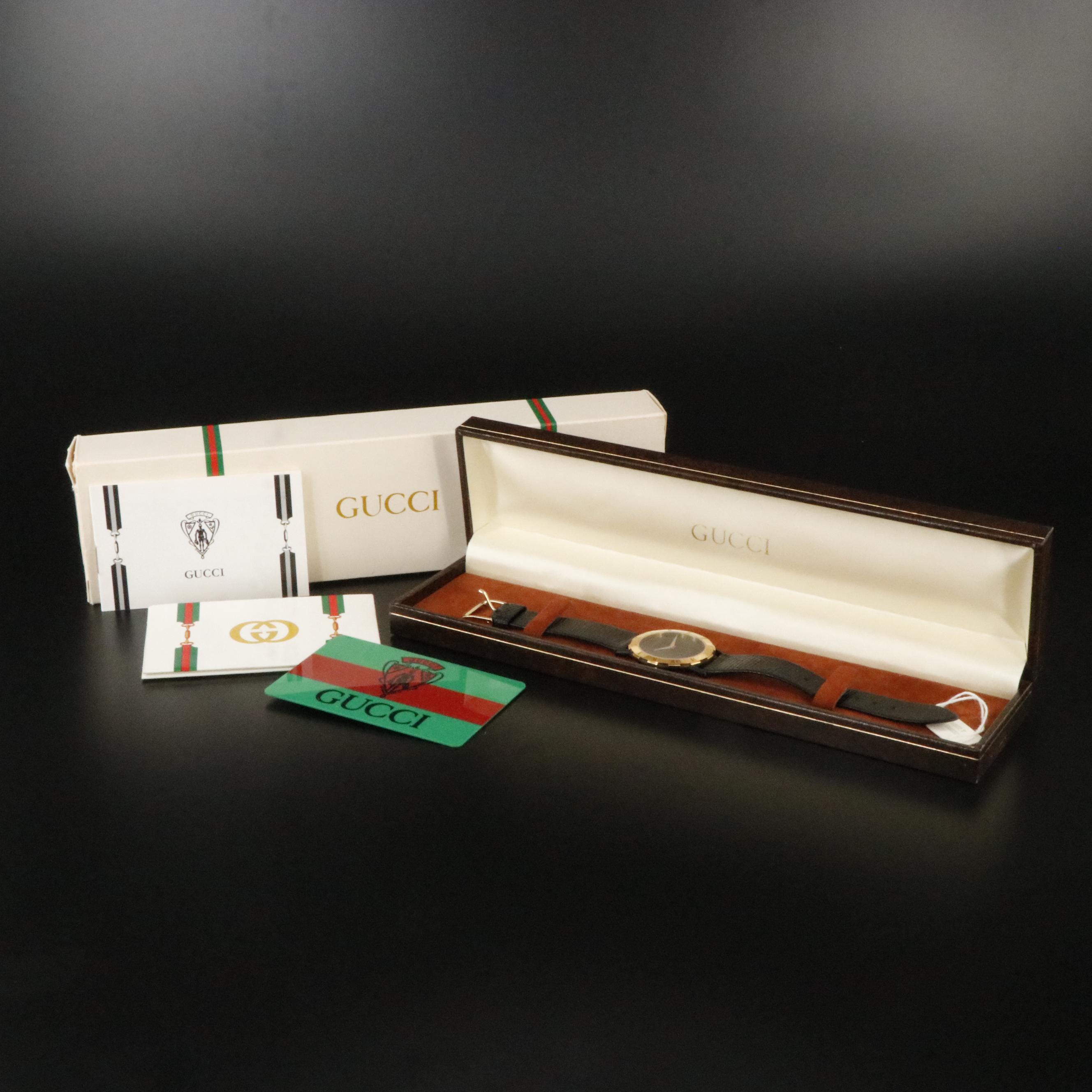 Gucci Black Dial Gold Tone Bezel Watch