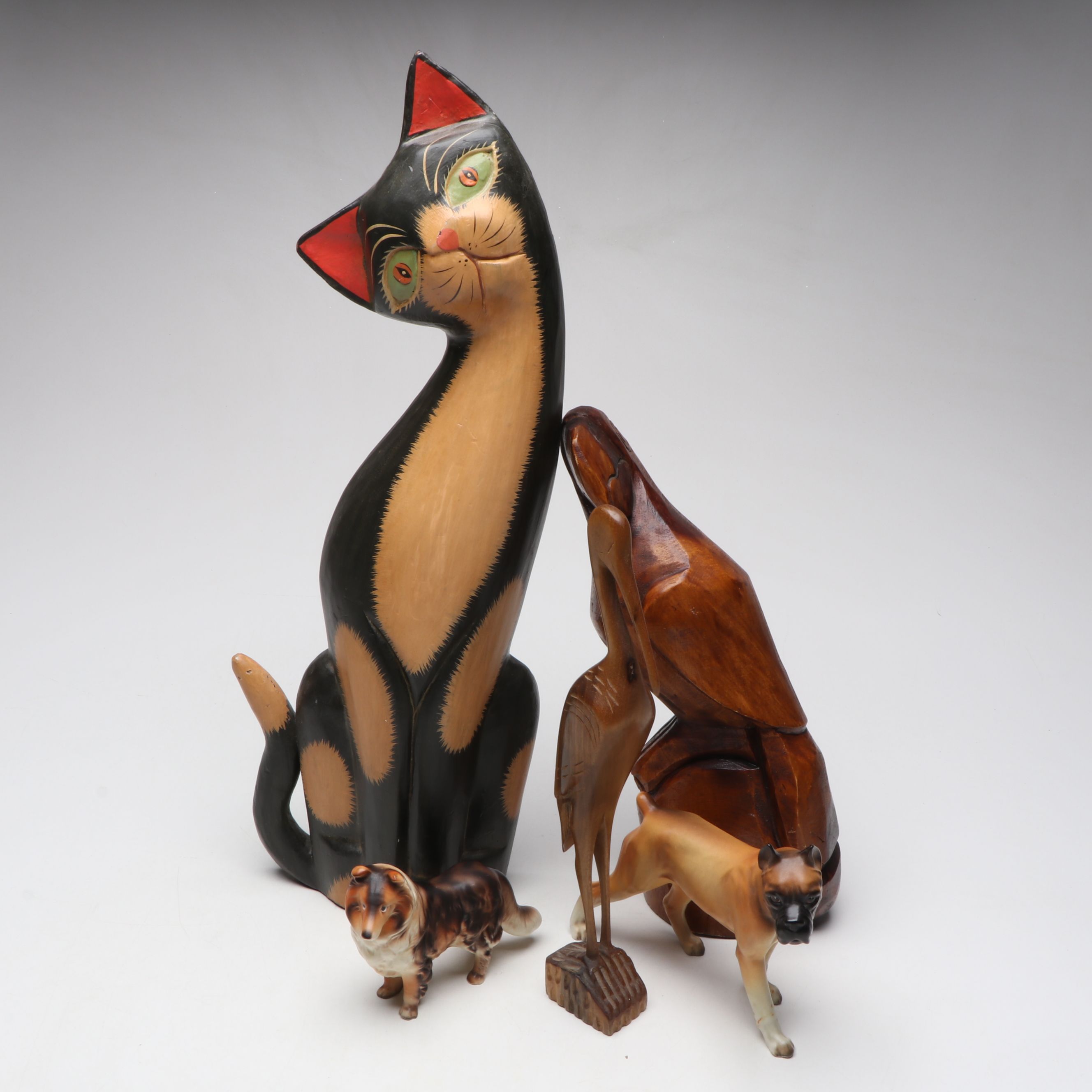 Brimm's and Other Porcelain Dogs with Carved Wooden Animals
