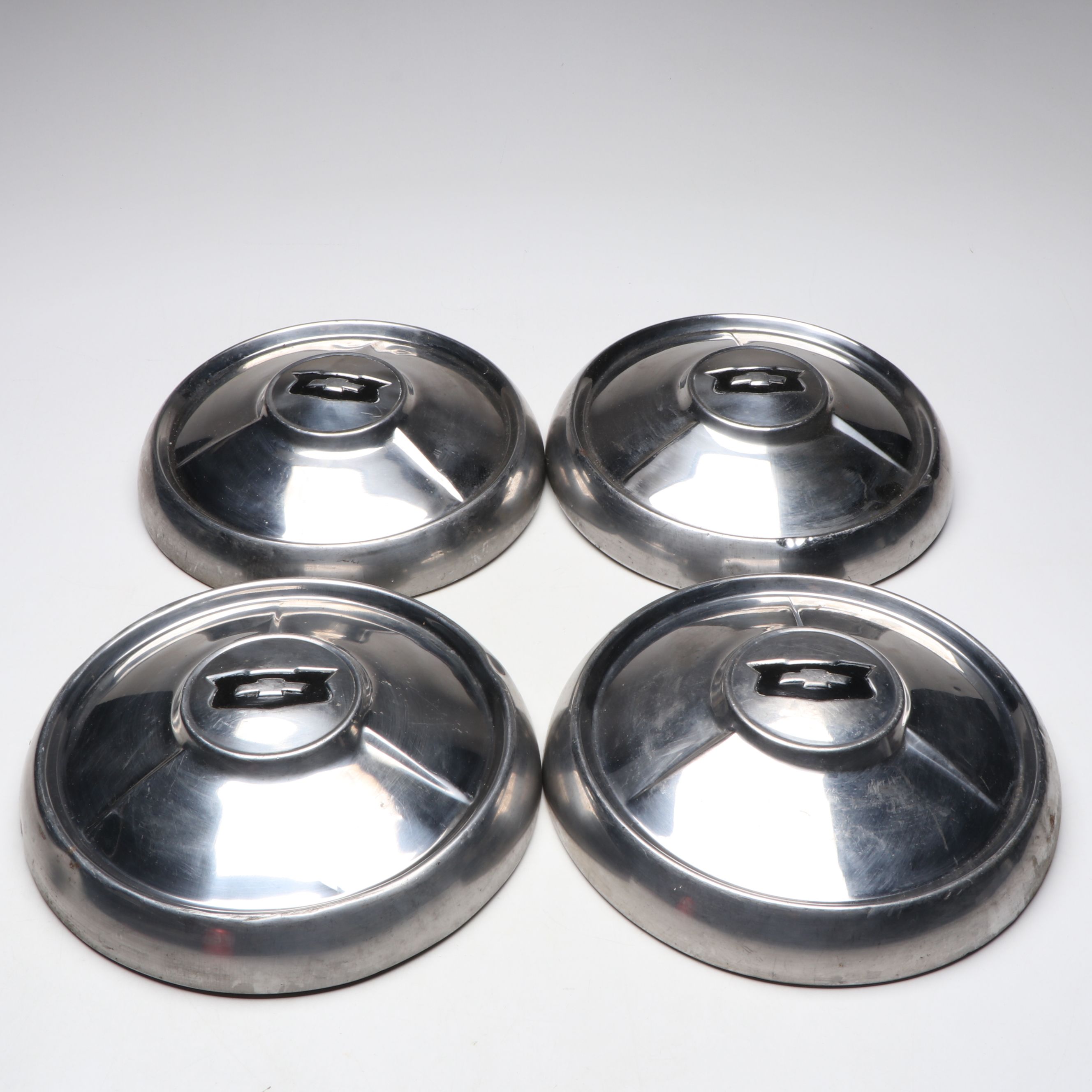 Set of Four Chevrolet "Dog Dish" Metal Hubcaps, 1960s–1970s