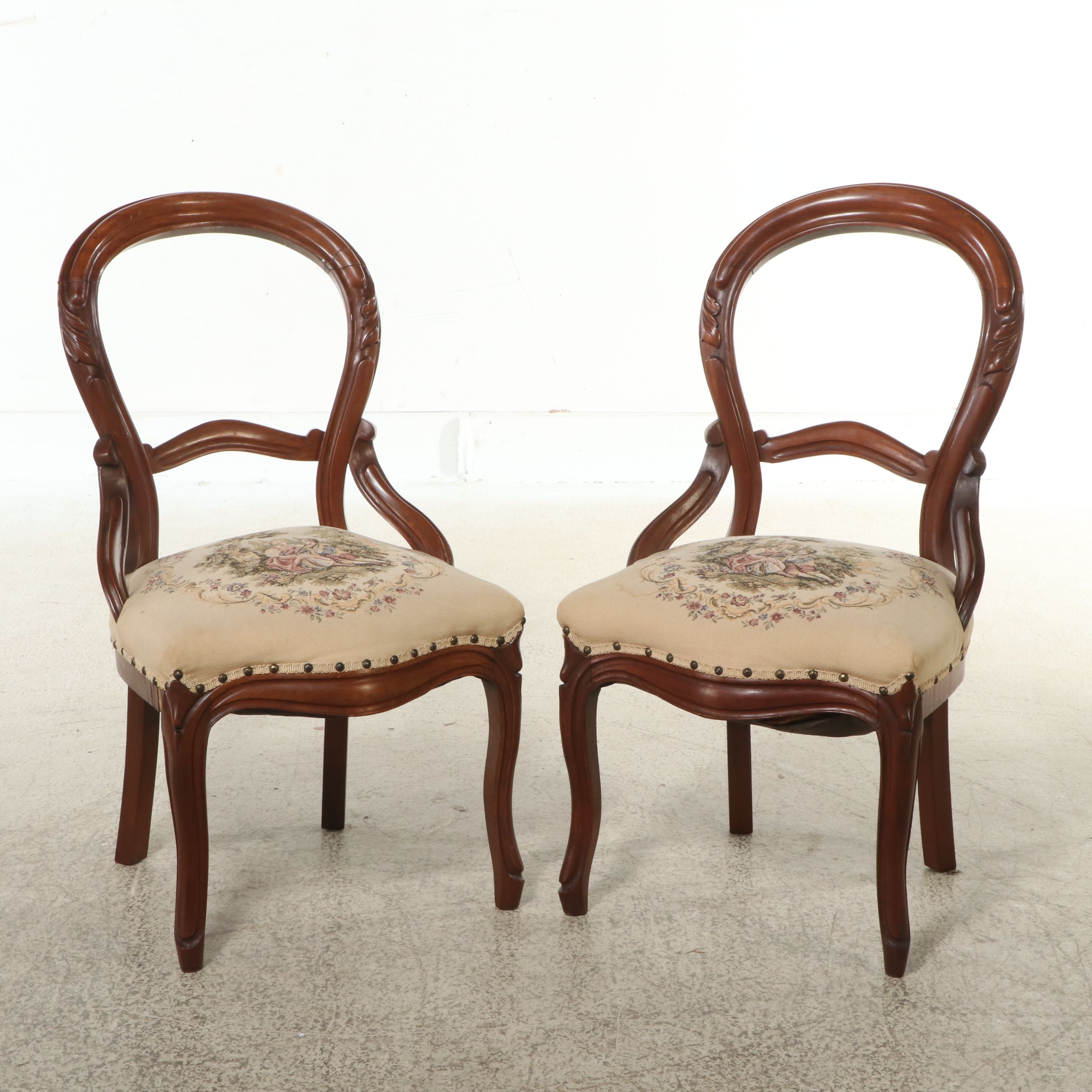 Pair of Victorian Style Carved Walnut Balloon Back Chairs with Needlepoint Seats