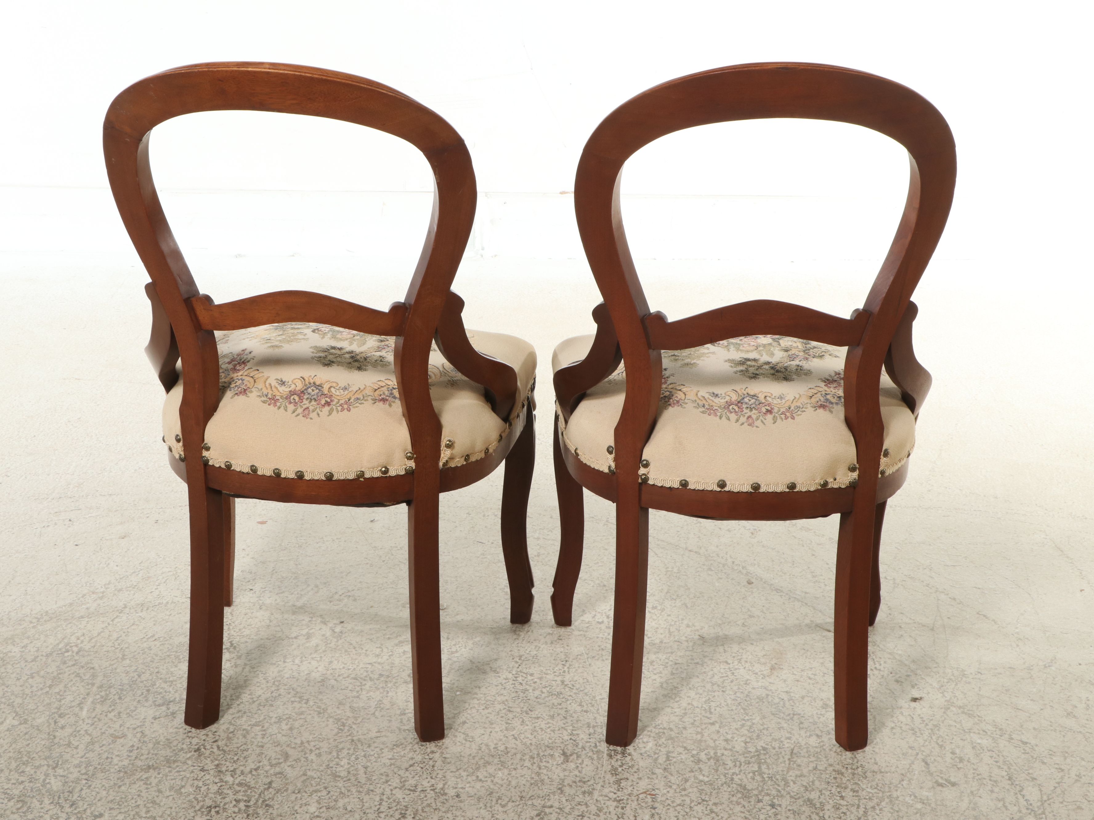Pair of Victorian Style Carved Walnut Balloon Back Chairs with Needlepoint Seats