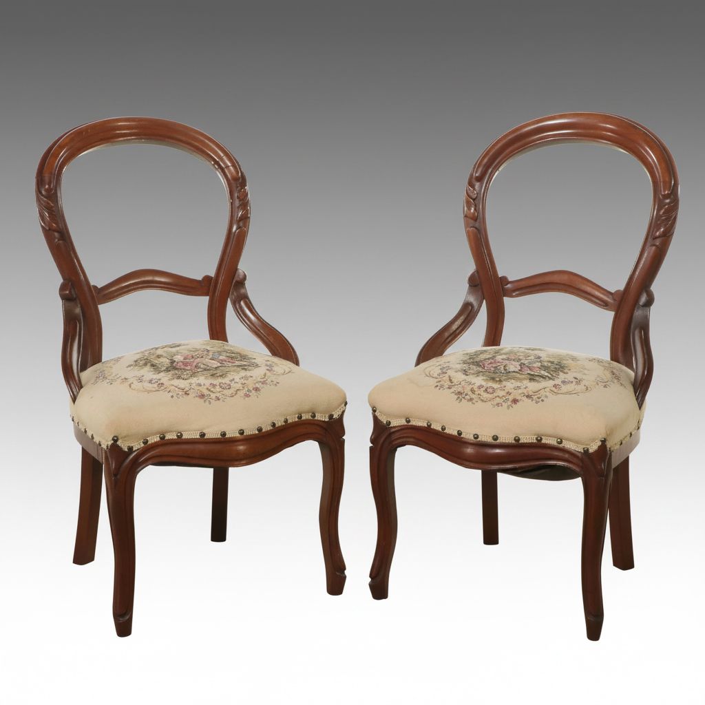 Pair of Victorian Style Carved Walnut Balloon Back Chairs with Needlepoint Seats