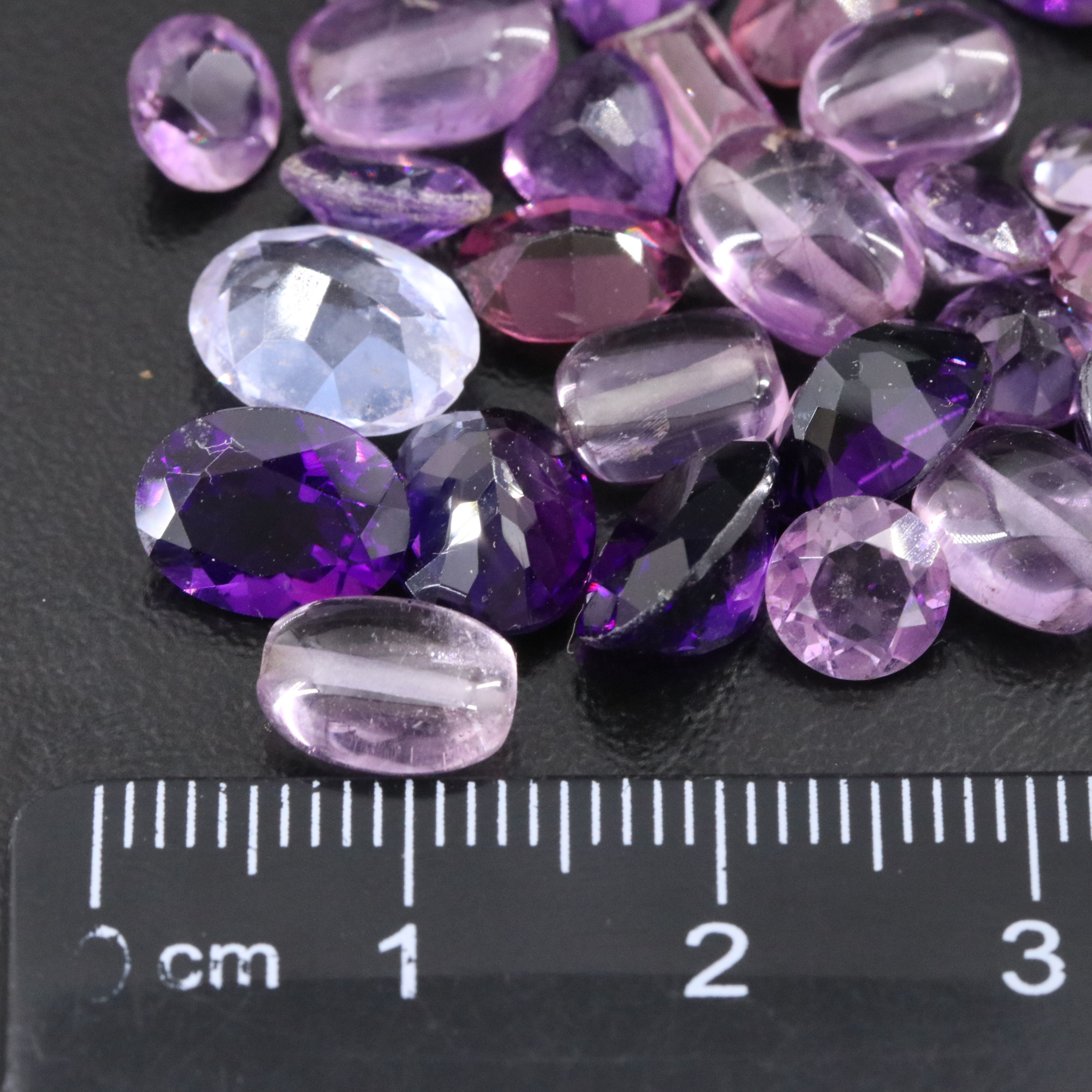 Loose 86.81 CTW Gemstones Featuring Amethyst, CZ and Glass