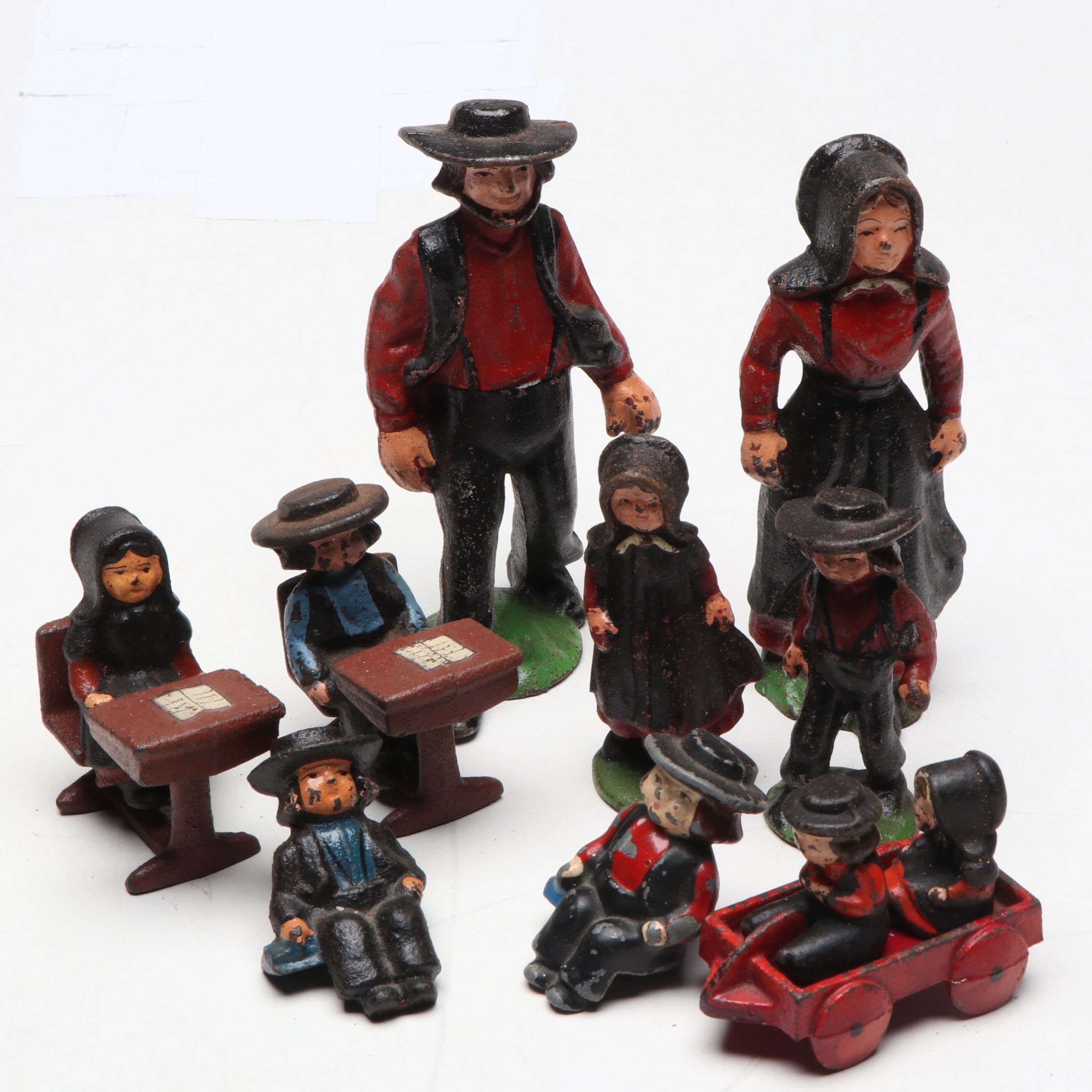 Painted Cast Iron Amish Family Figurines, Mid-20th Century
