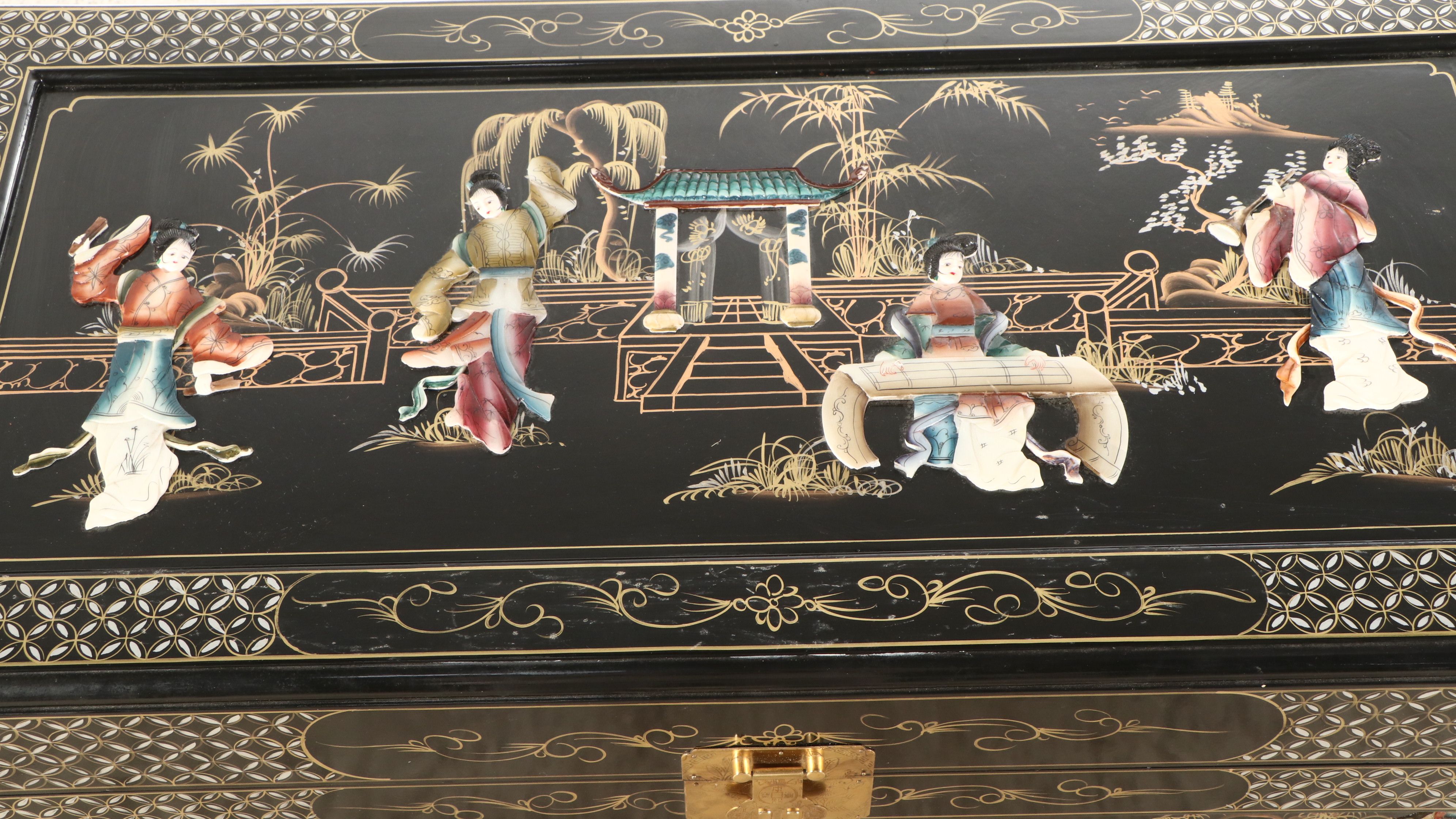 Chinese Lacquered Wood Trunk with Raised Decorations