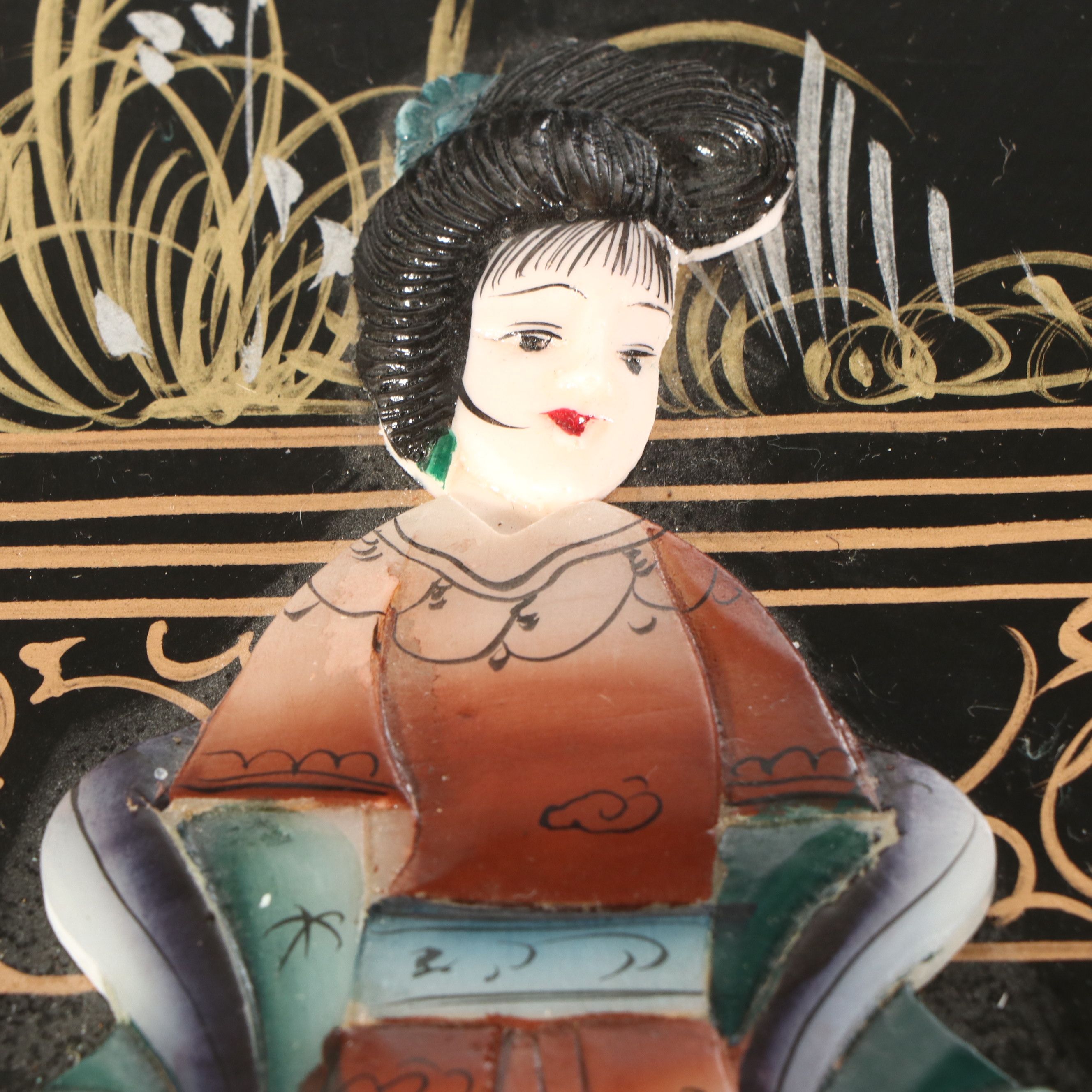 Chinese Lacquered Wood Trunk with Raised Decorations