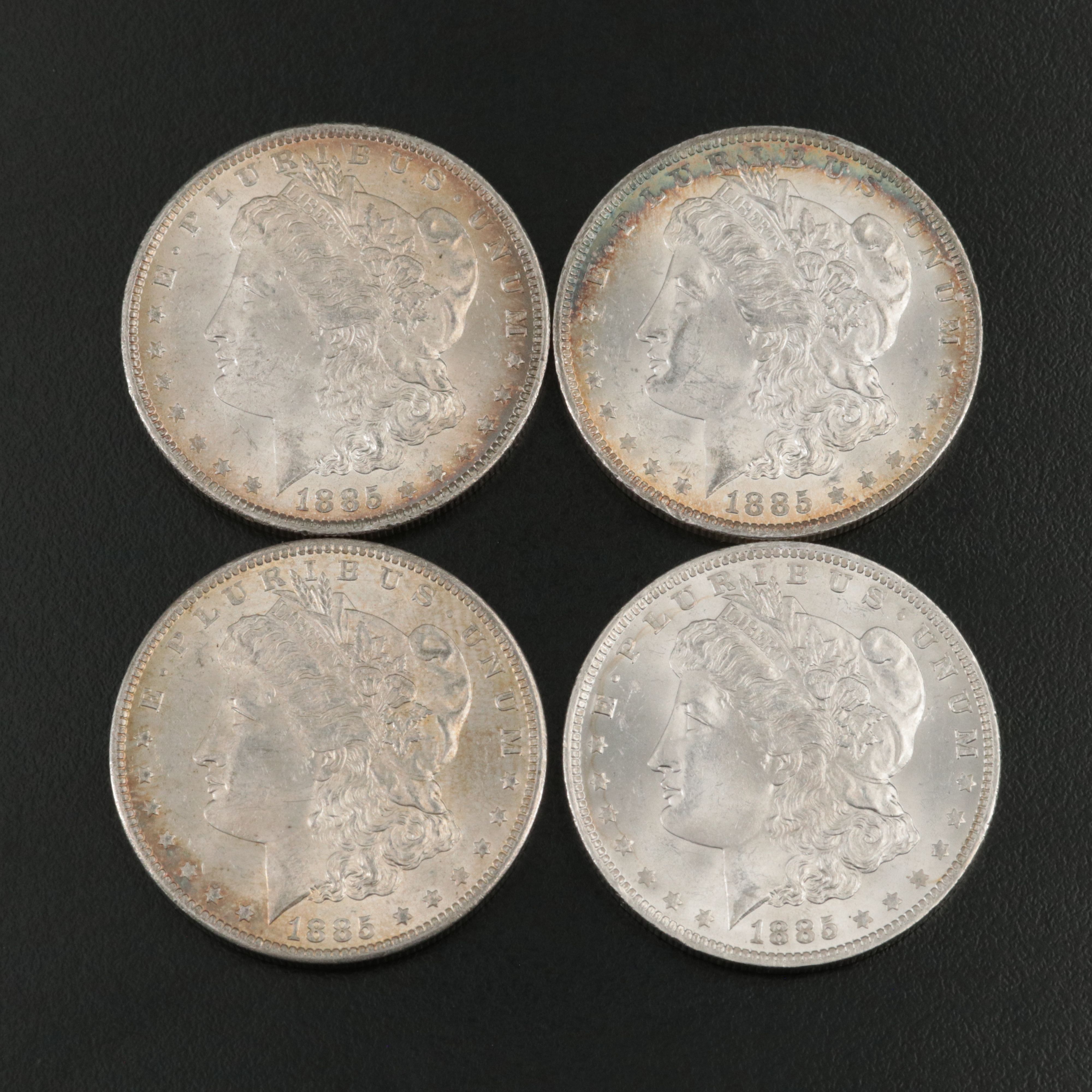 Four 1885-O Uncirculated Morgan Silver Dollars