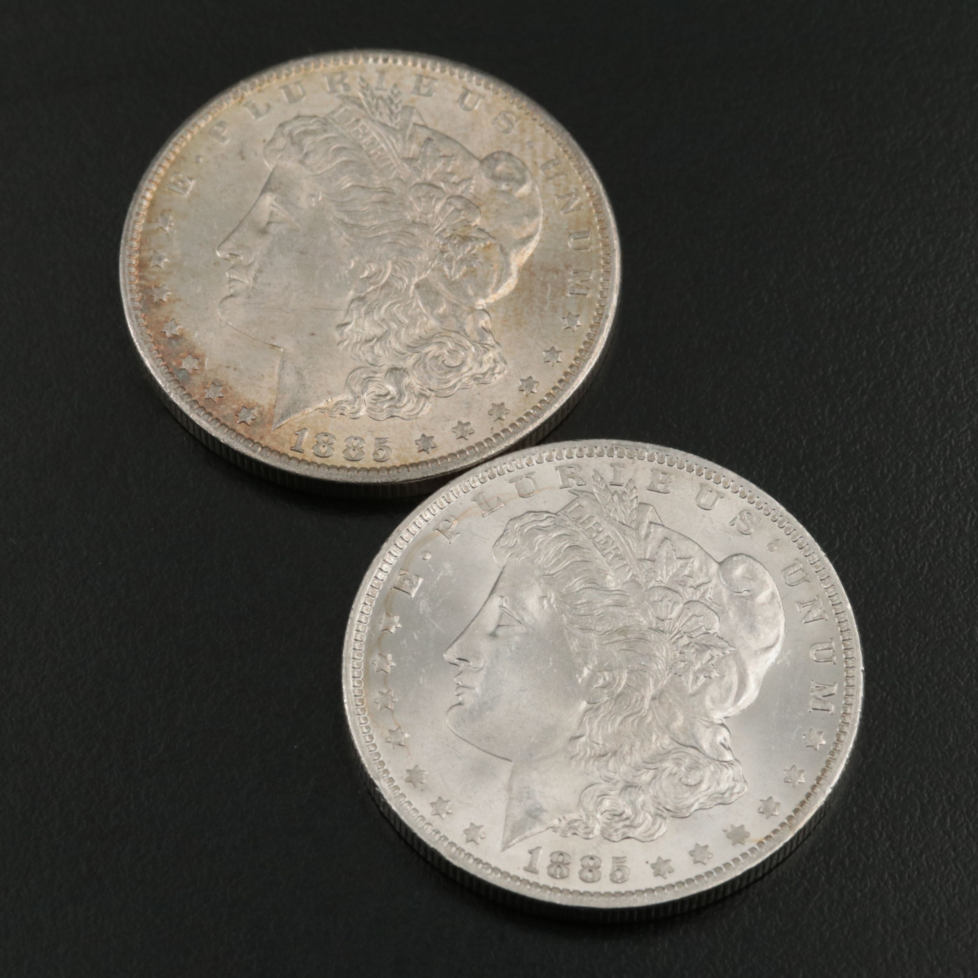 Four 1885-O Uncirculated Morgan Silver Dollars