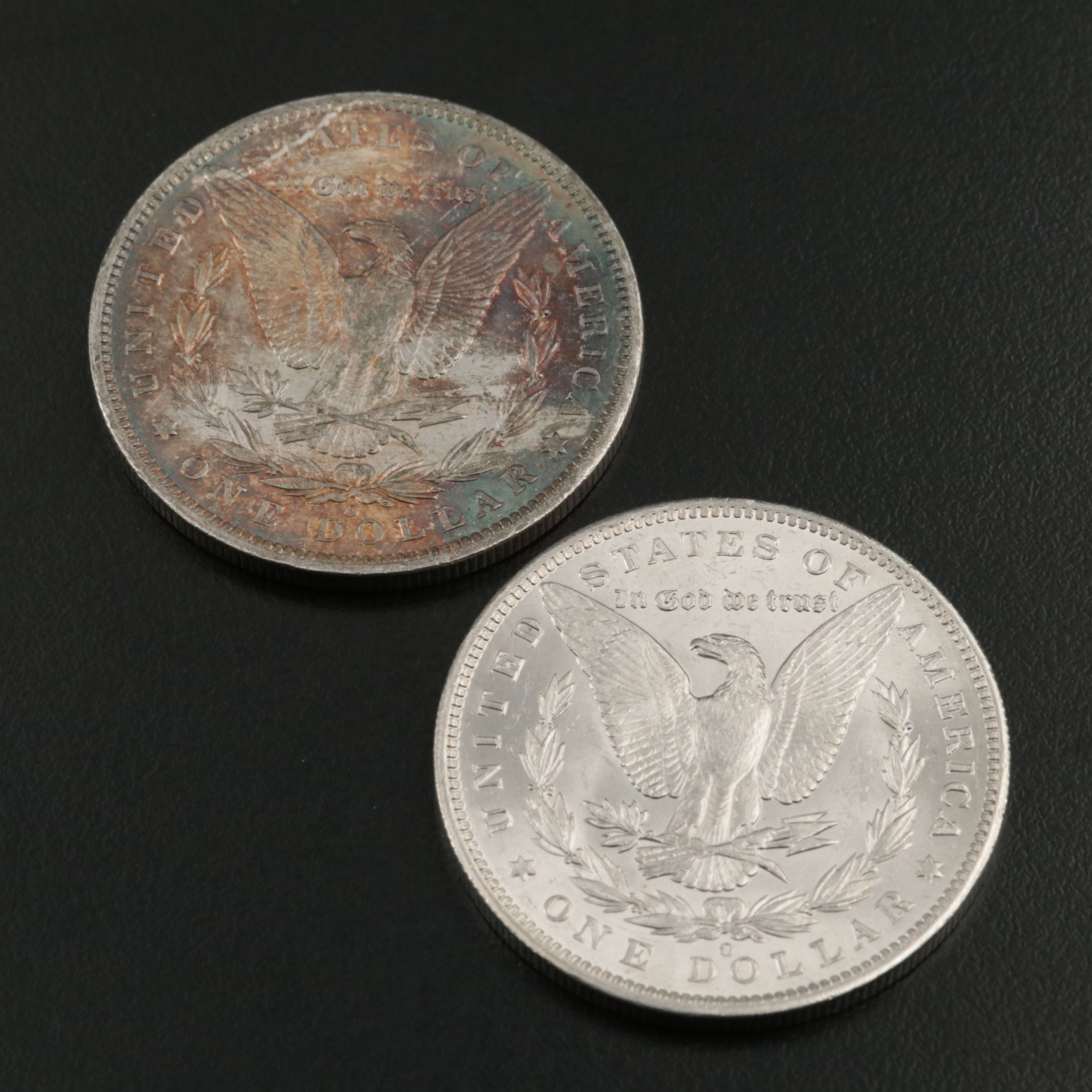 Four 1885-O Uncirculated Morgan Silver Dollars