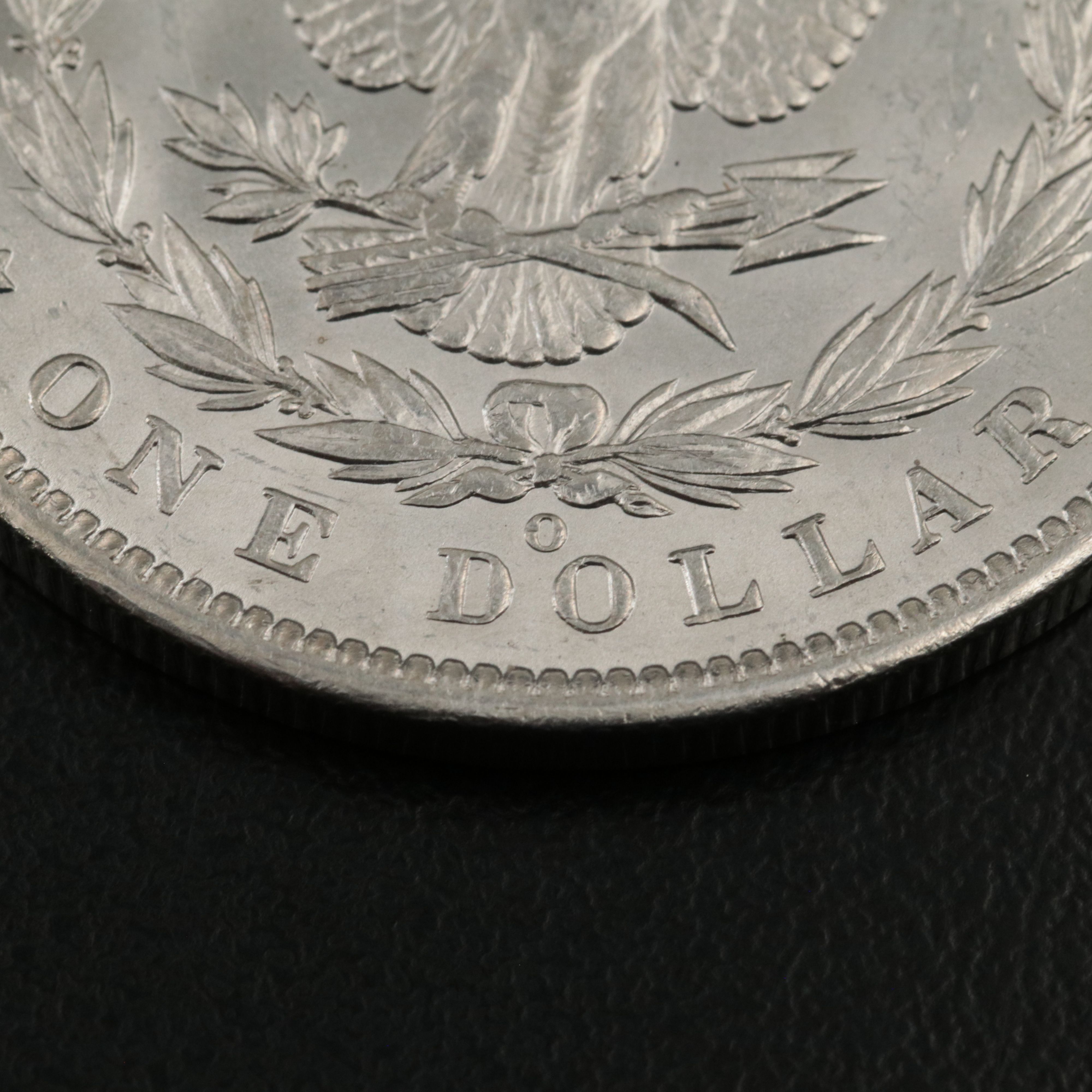 Four 1885-O Uncirculated Morgan Silver Dollars