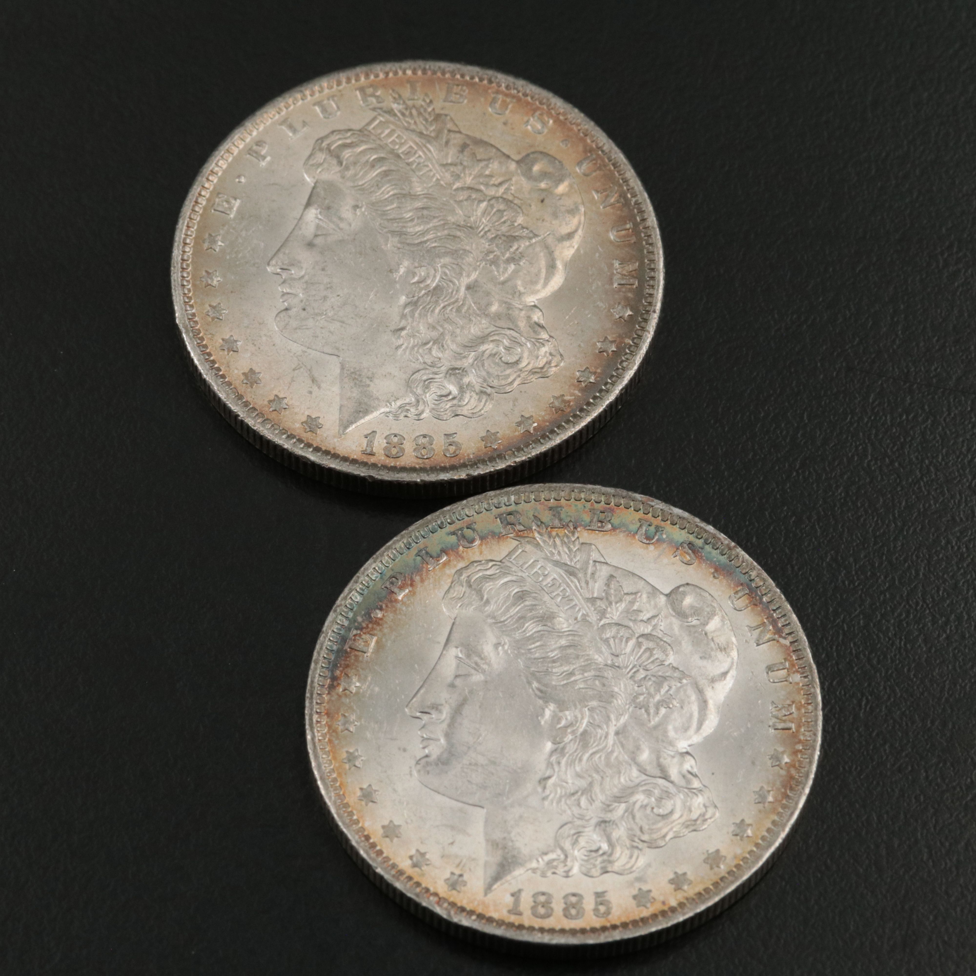 Four 1885-O Uncirculated Morgan Silver Dollars