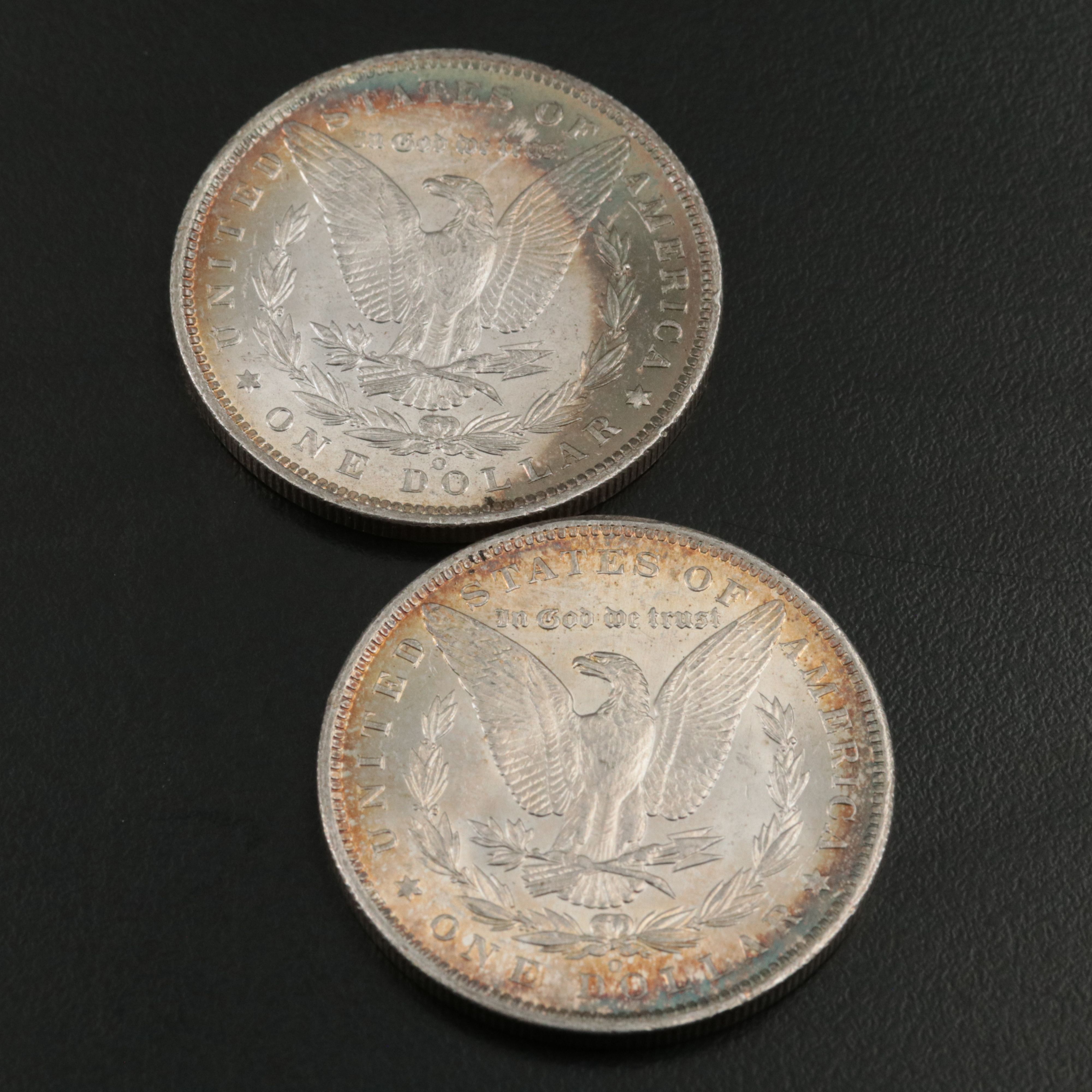 Four 1885-O Uncirculated Morgan Silver Dollars