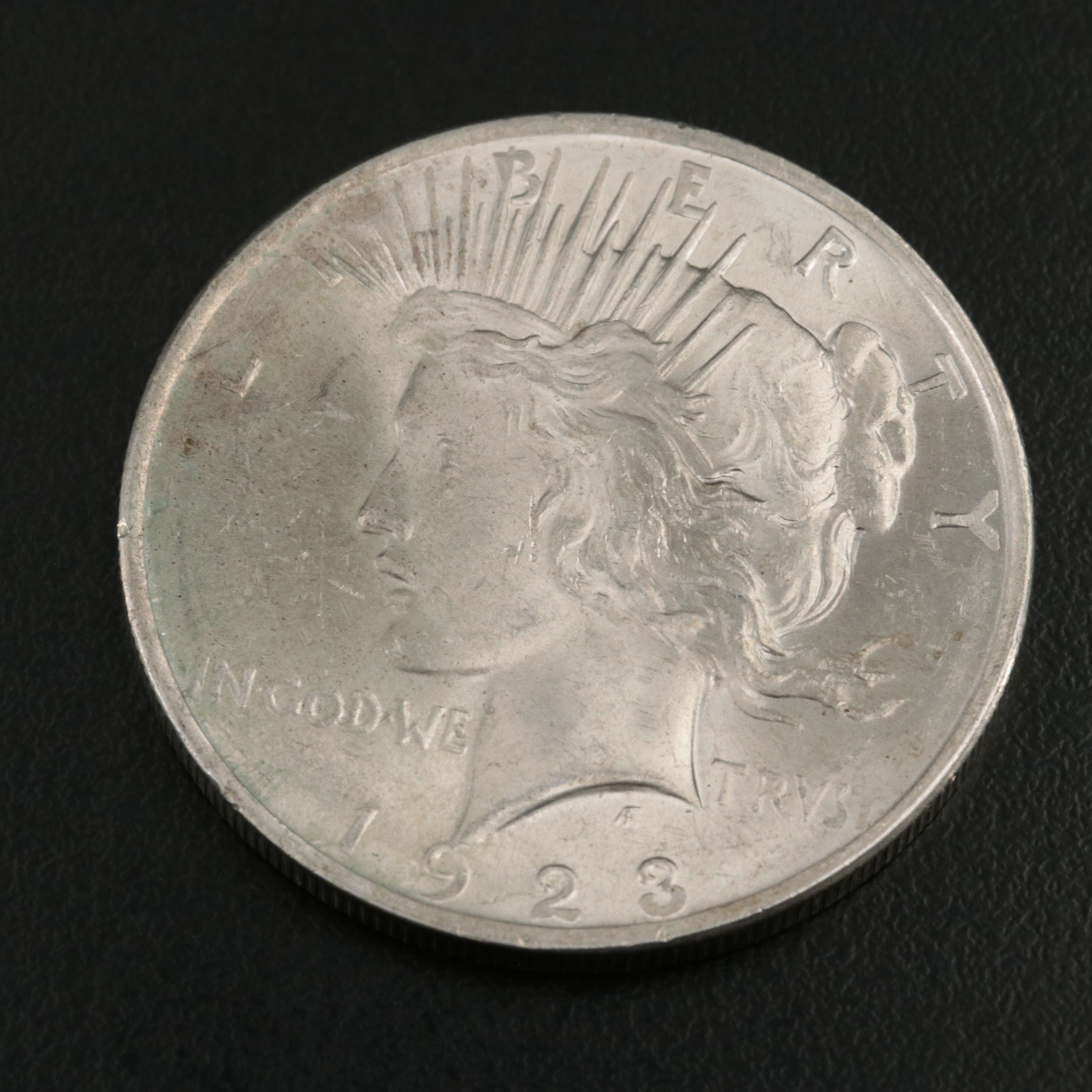 Two Uncirculated  U.S. Morgan and Peace Dollars