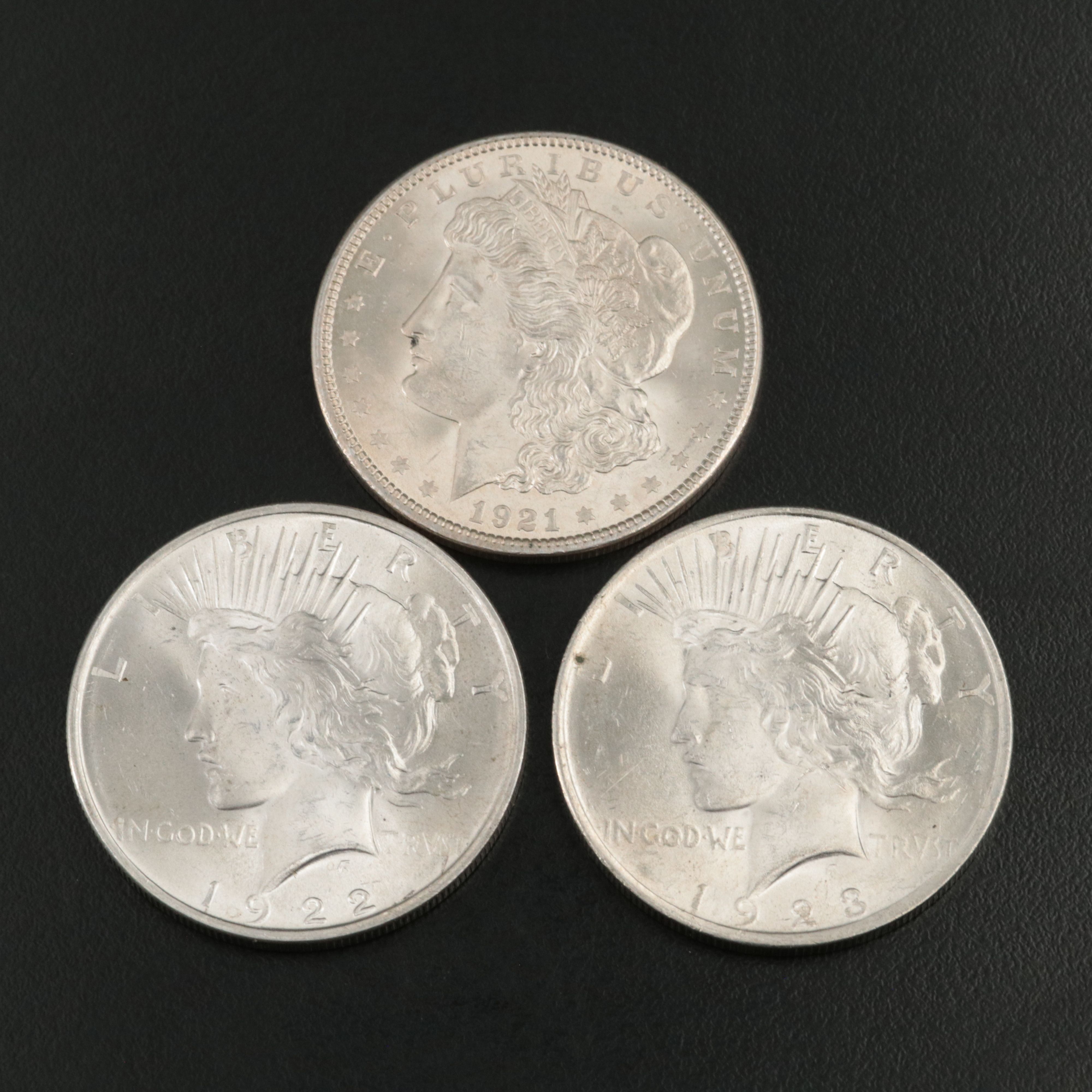Three Uncirculated  U.S. Morgan and Peace Silver Dollars