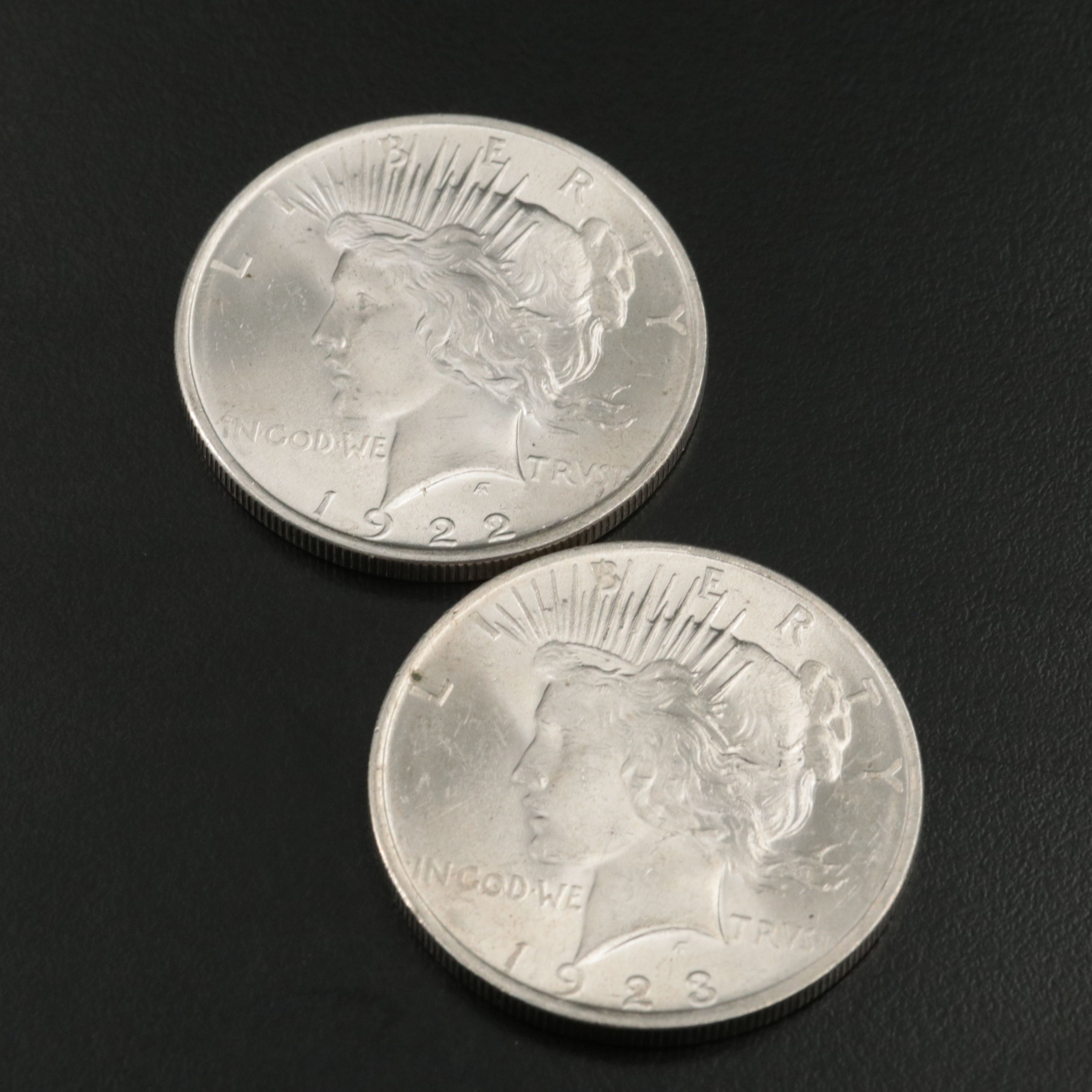 Three Uncirculated  U.S. Morgan and Peace Silver Dollars