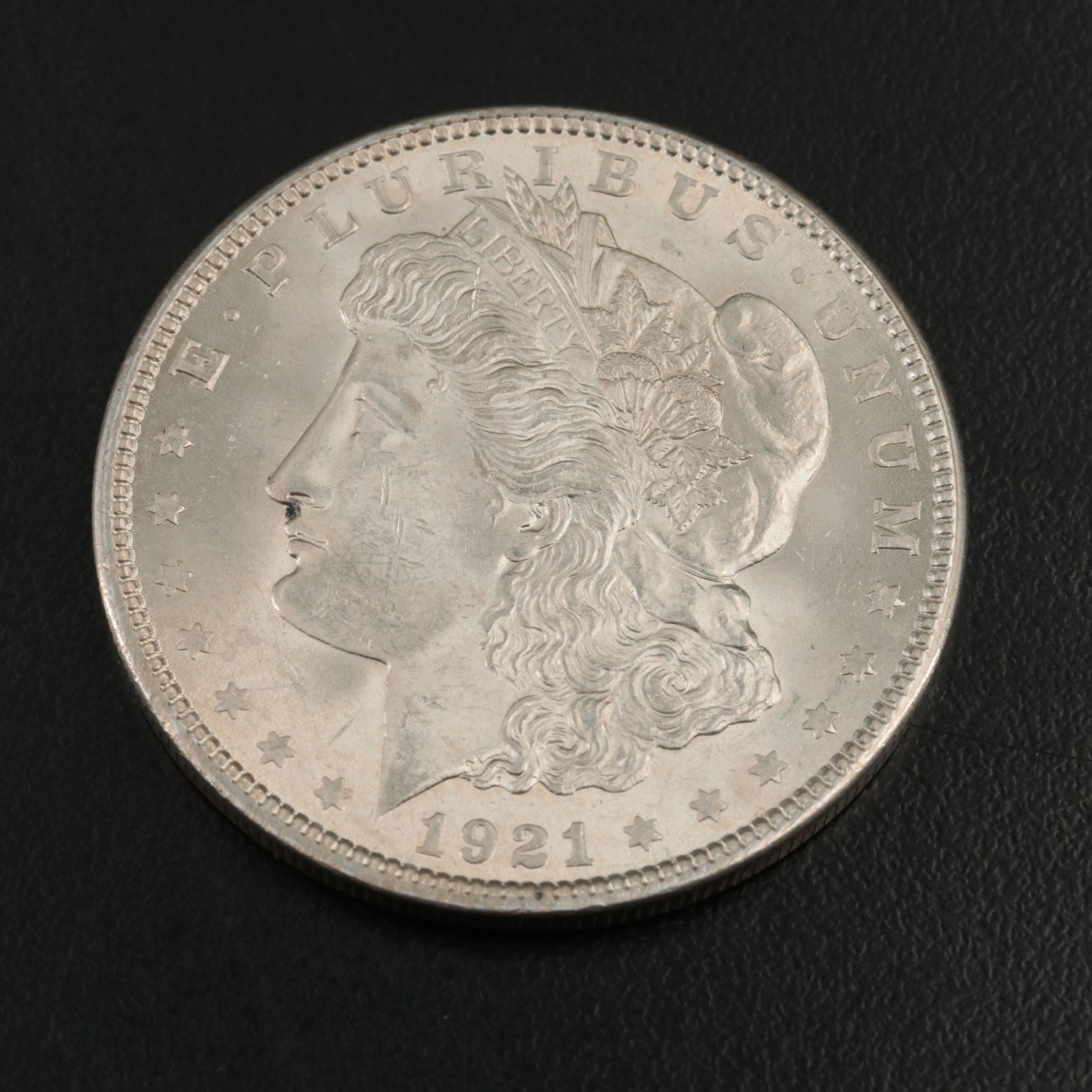 Three Uncirculated  U.S. Morgan and Peace Silver Dollars