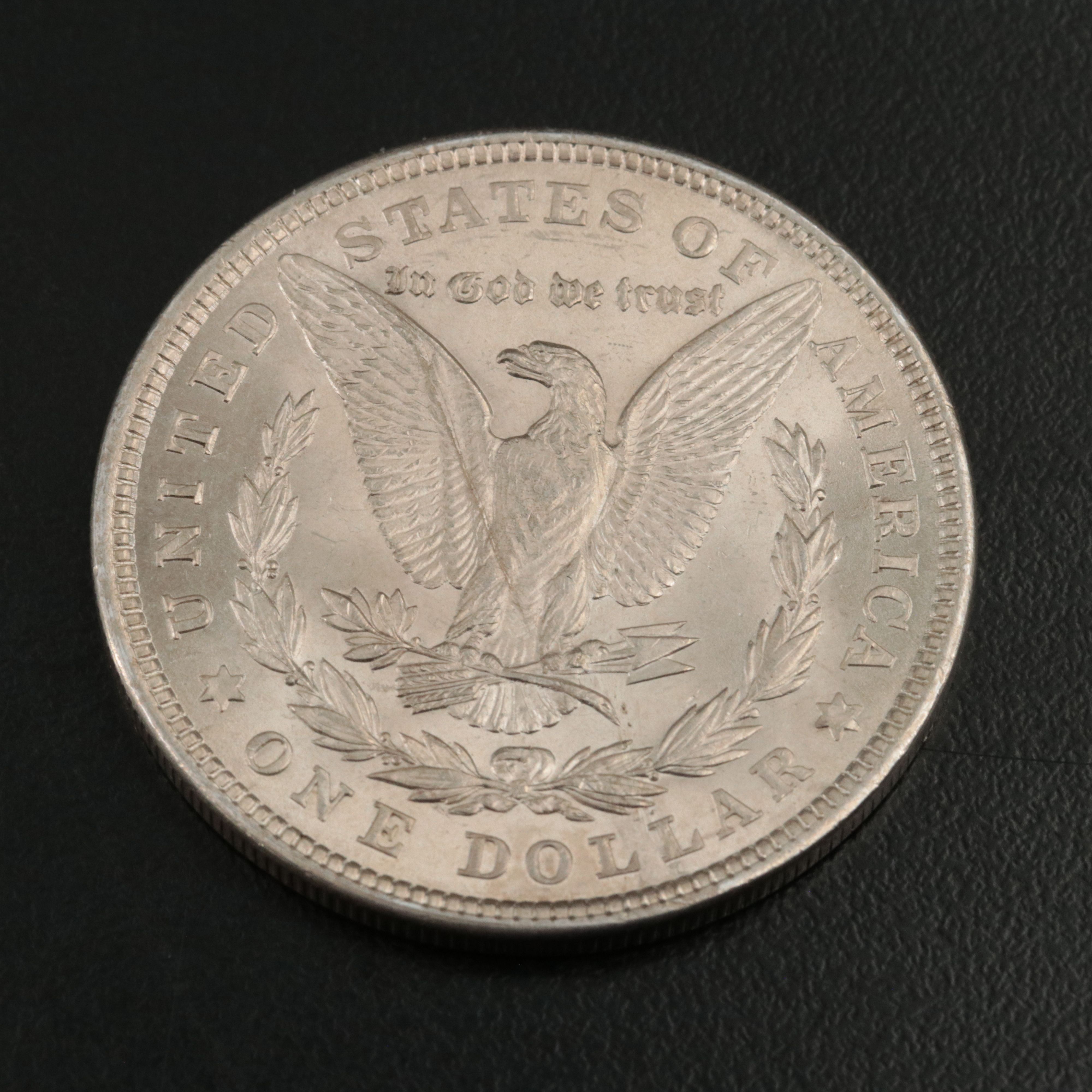 Three Uncirculated  U.S. Morgan and Peace Silver Dollars