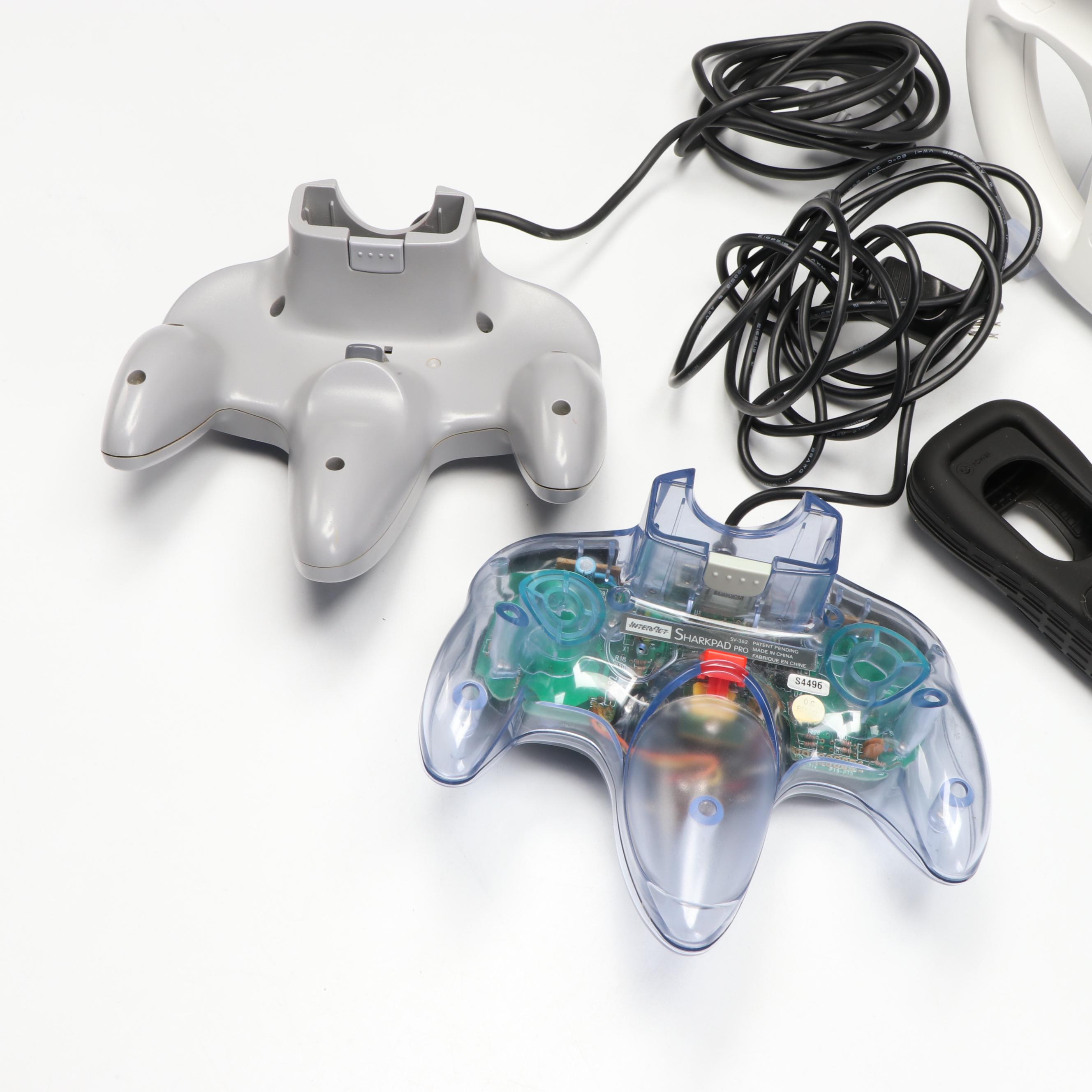 Nintendo 64 Controllers with Wii Remote, Jacket and Wheel Accessory