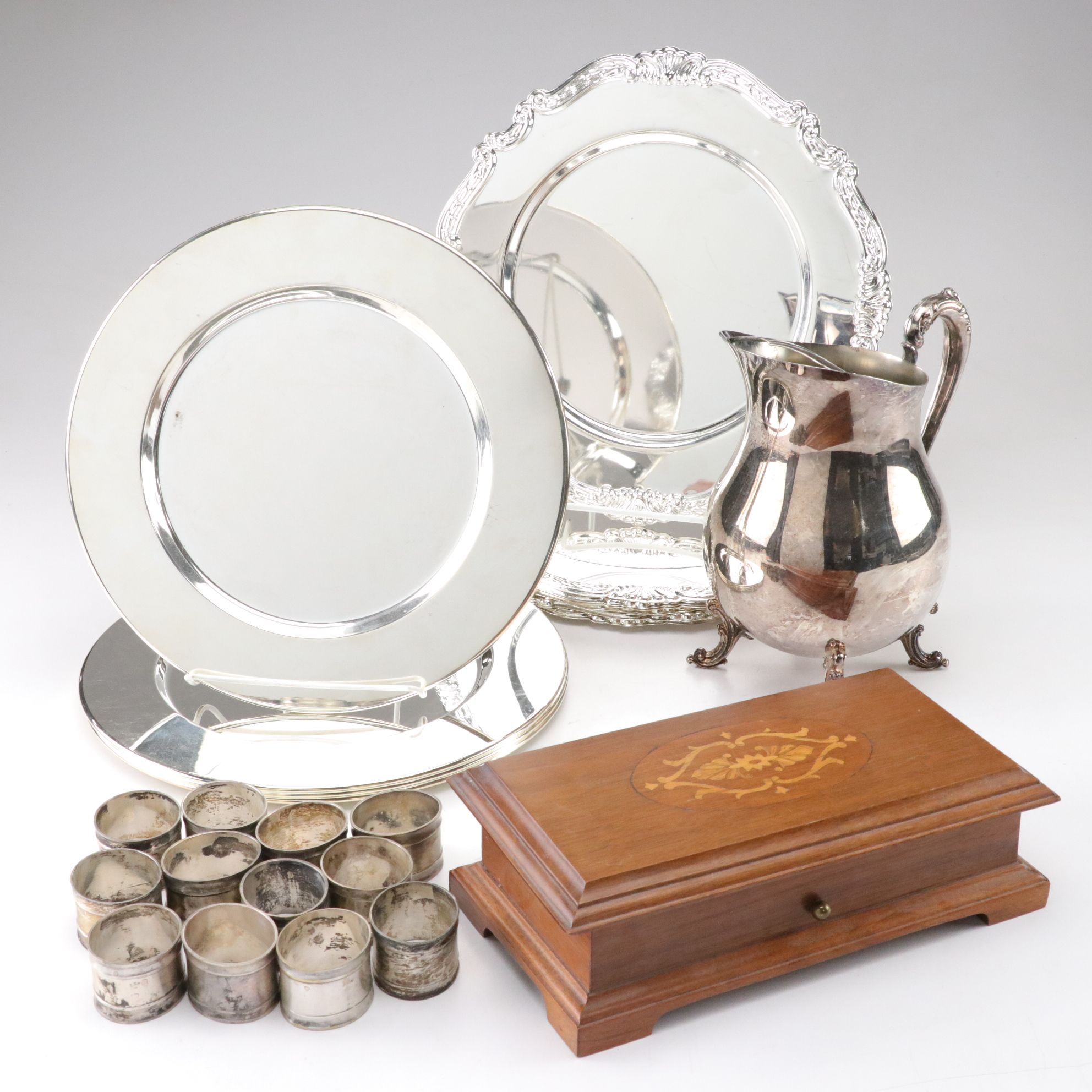 Silver Plate Water Pitcher with Chargers, Napkin Rings, and a Music Box