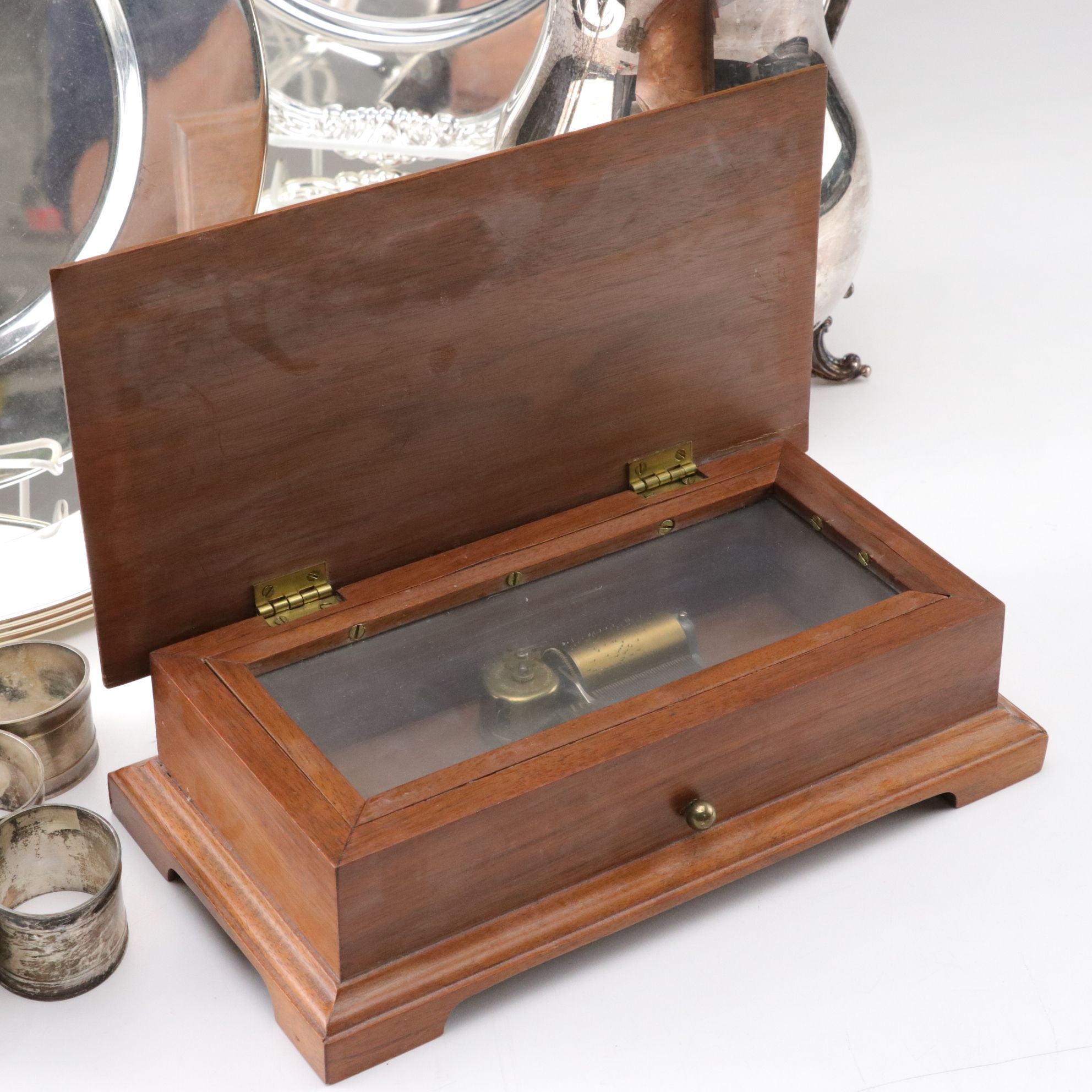Silver Plate Water Pitcher with Chargers, Napkin Rings, and a Music Box