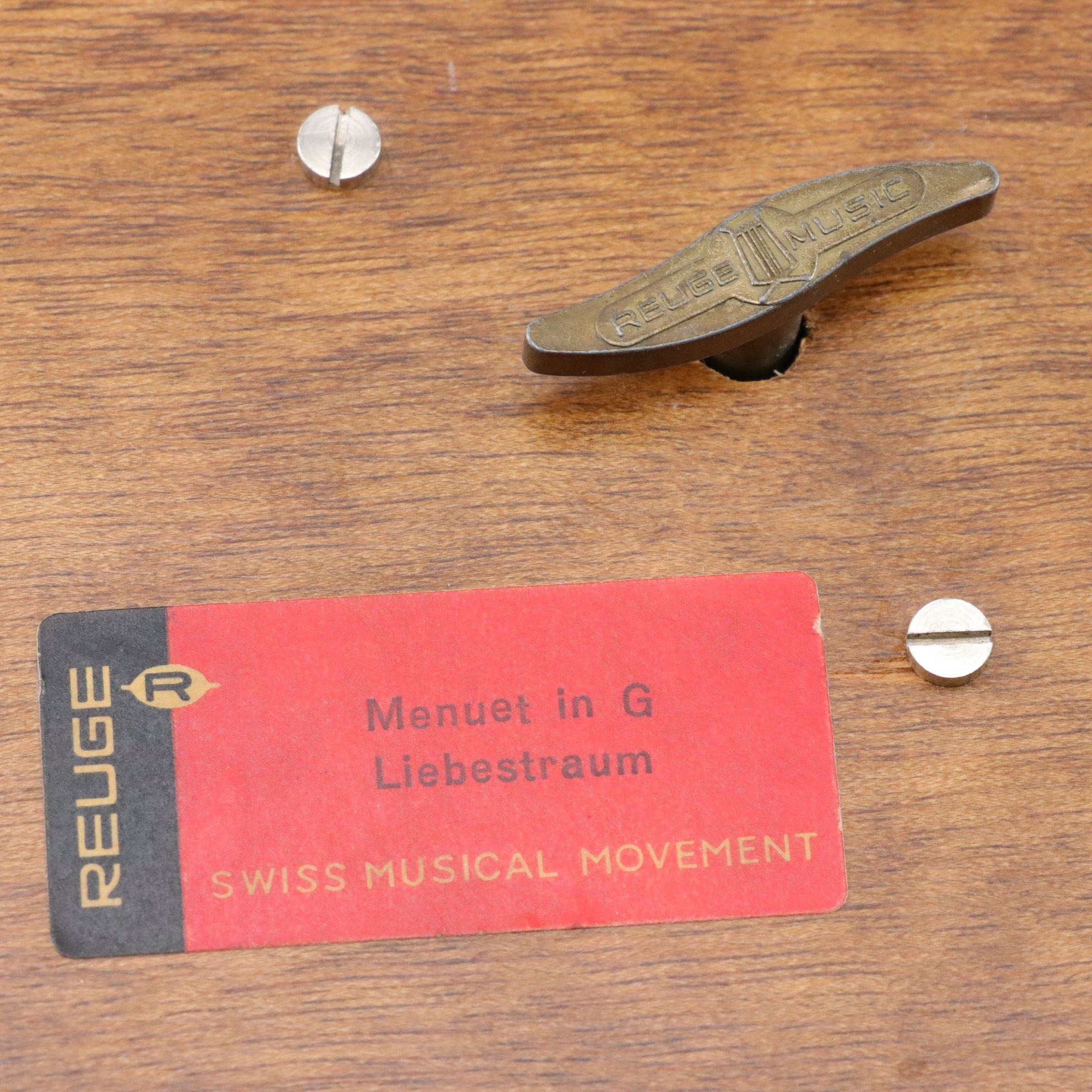 Silver Plate Water Pitcher with Chargers, Napkin Rings, and a Music Box