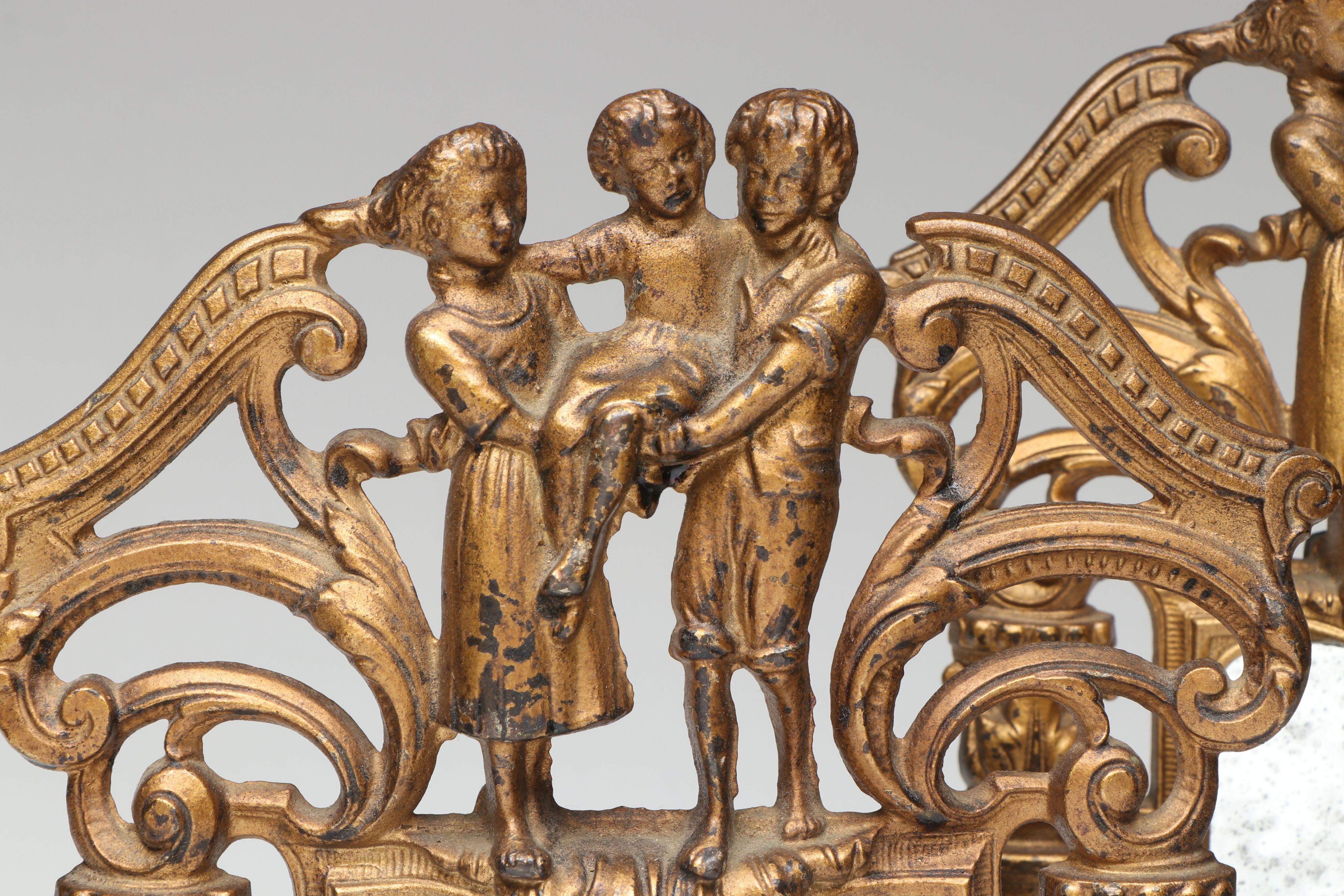 Brass Figural Framed Mirror Pair