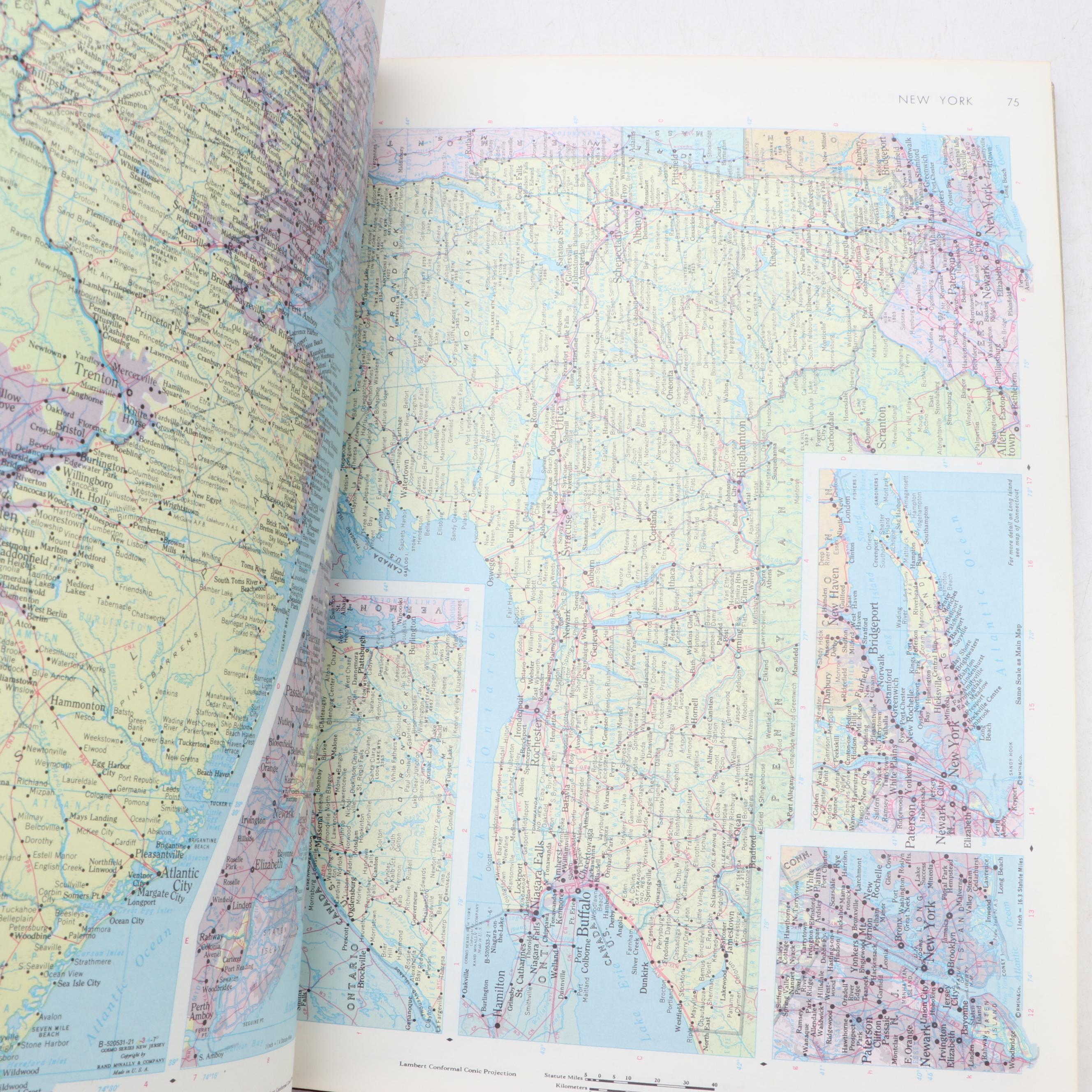 "Webster's New Twentieth Century Dictionary" with "Rand McNally World Atlas"
