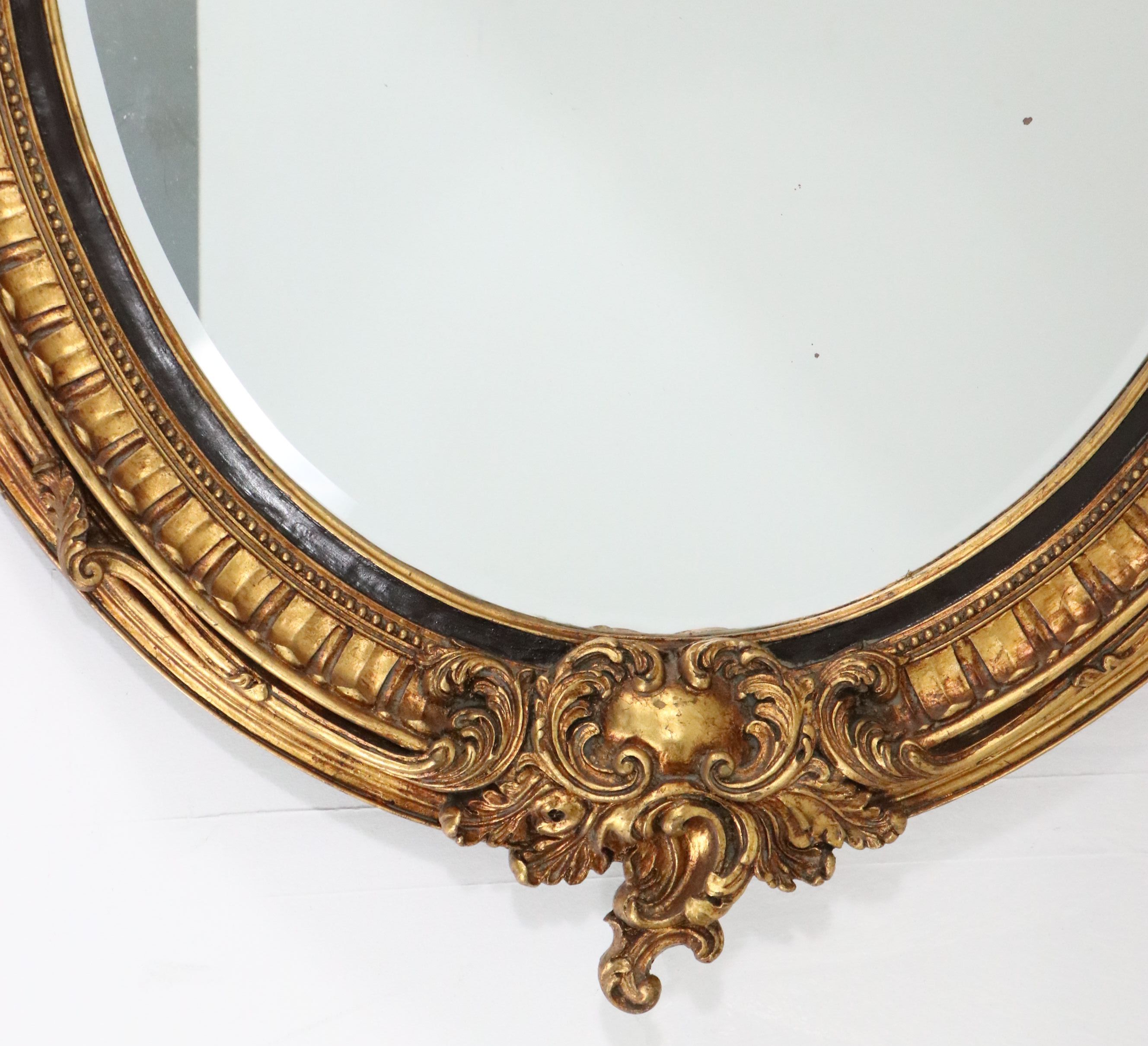 French Louis XVI Style Carved Giltwood Oval Wall Mirror, Late 19th/Early 20th C.