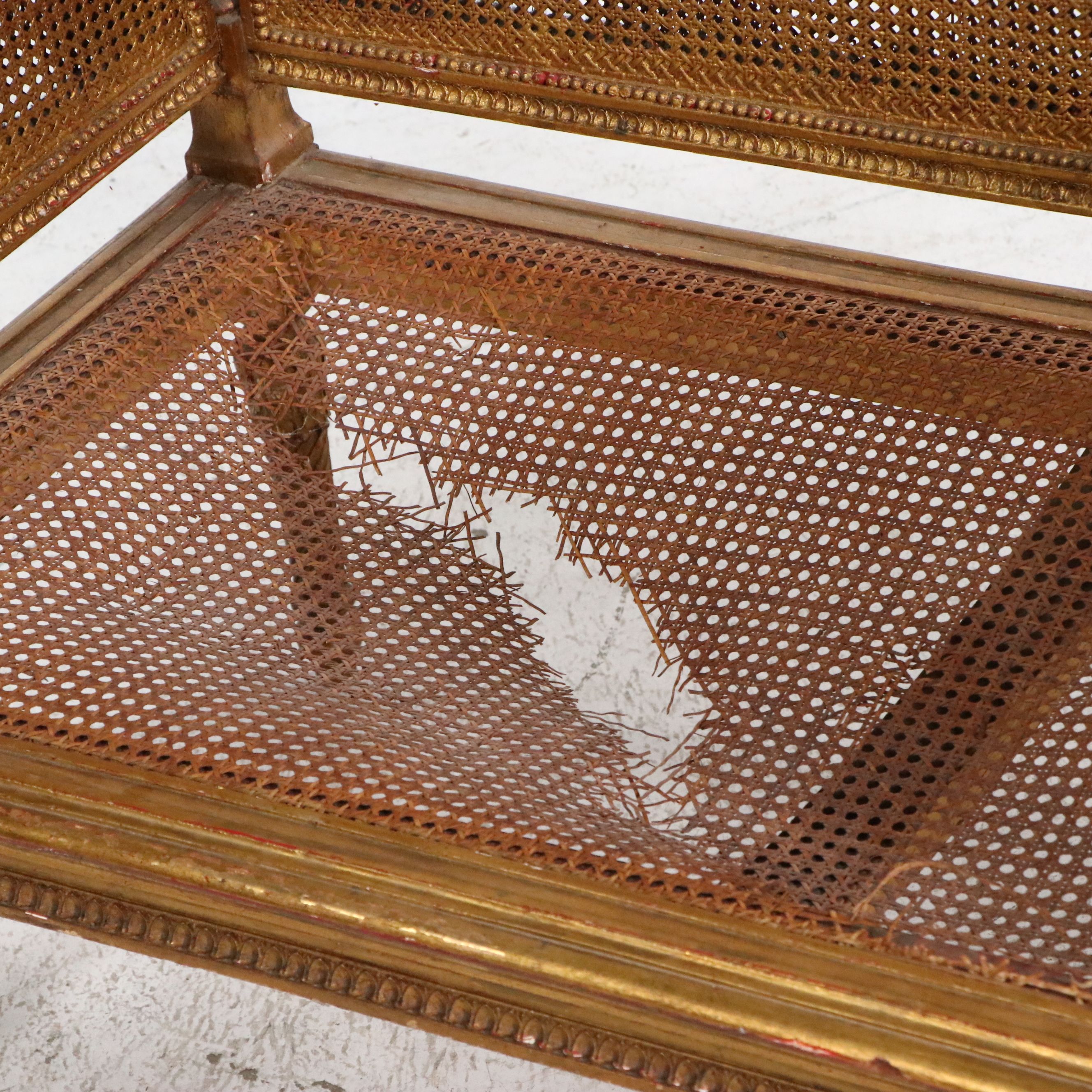 French Louis XVI Style Giltwood and Caned Canapé à Oreilles Settee, Late 19th C.