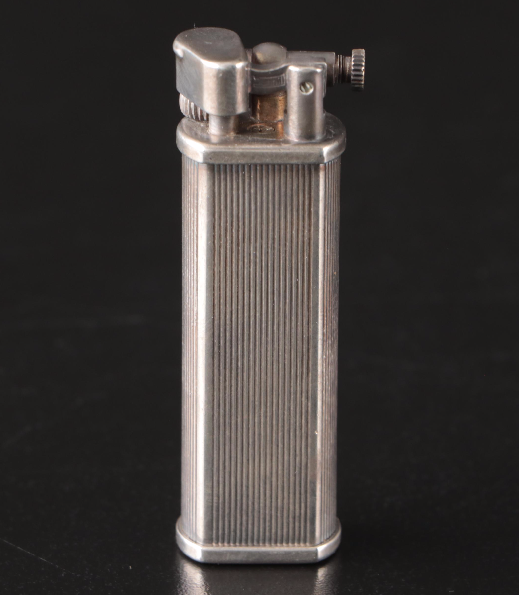 Tiffany & Co. Sterling Pill Case, Dunhill Sylphide Lighter and MOP Letter Opener