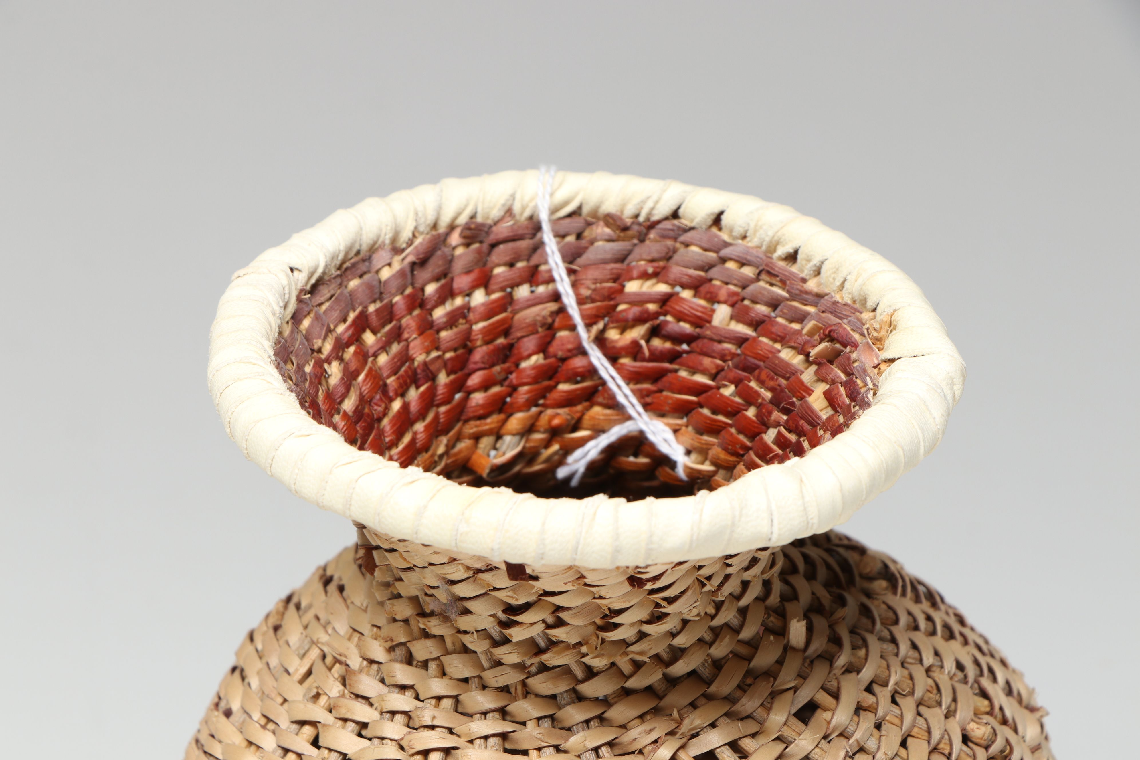 Novena Cobb Indé (Apache) Buckskin and Willow Tus with Other Basketry Vessel