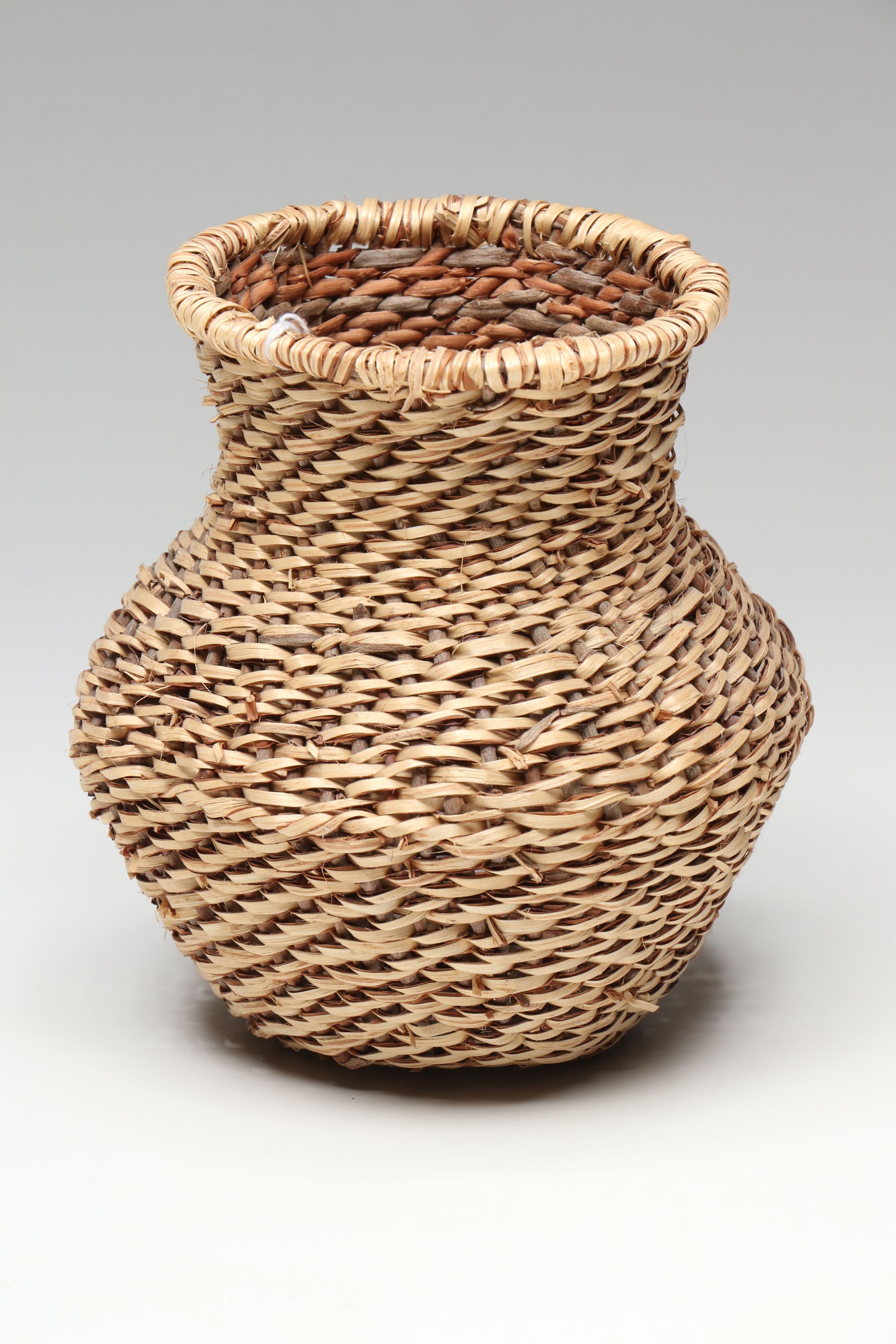 Novena Cobb Indé (Apache) Buckskin and Willow Tus with Other Basketry Vessel