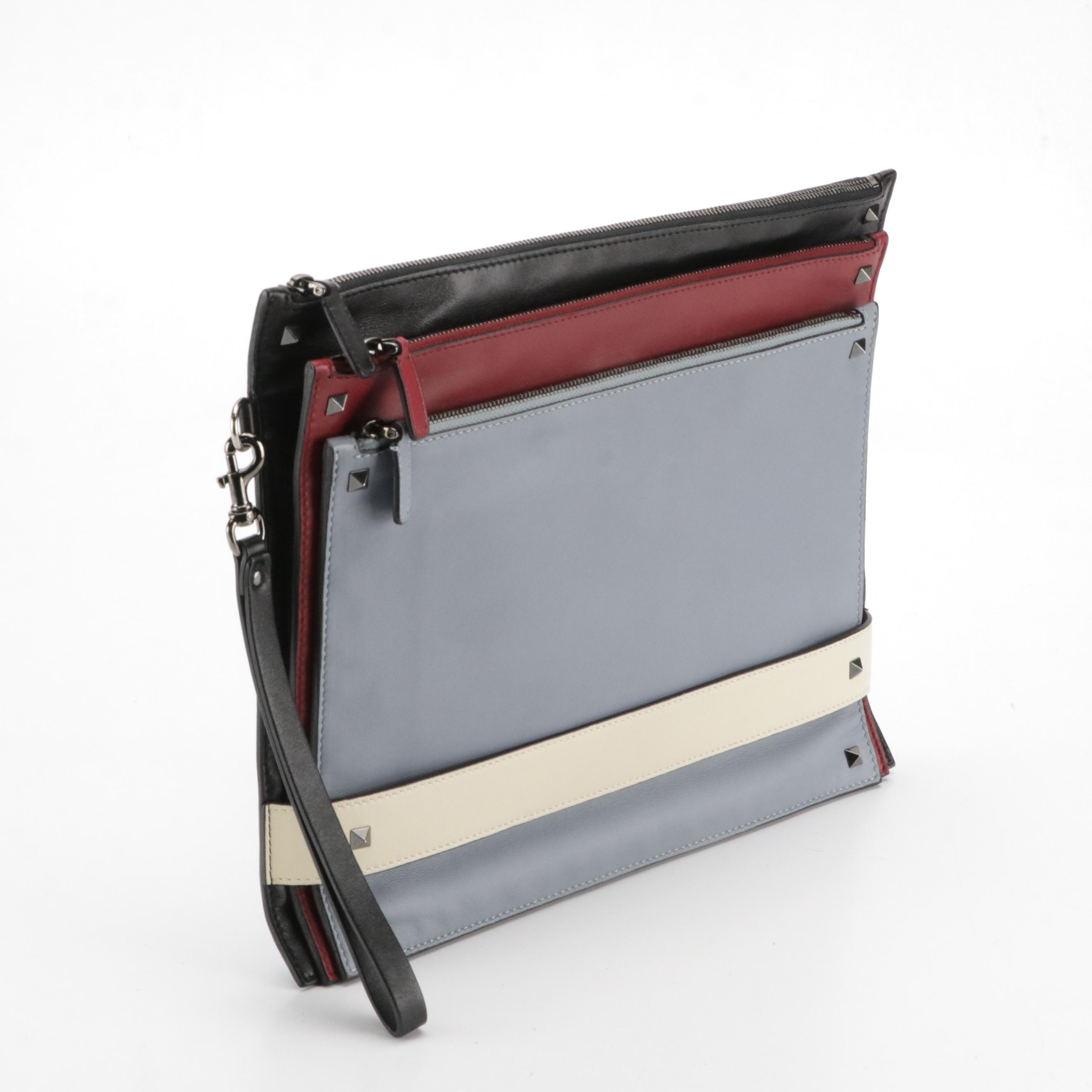 Valentino Garavani Rockstud Triple Zip Clutch in Calfskin Leather