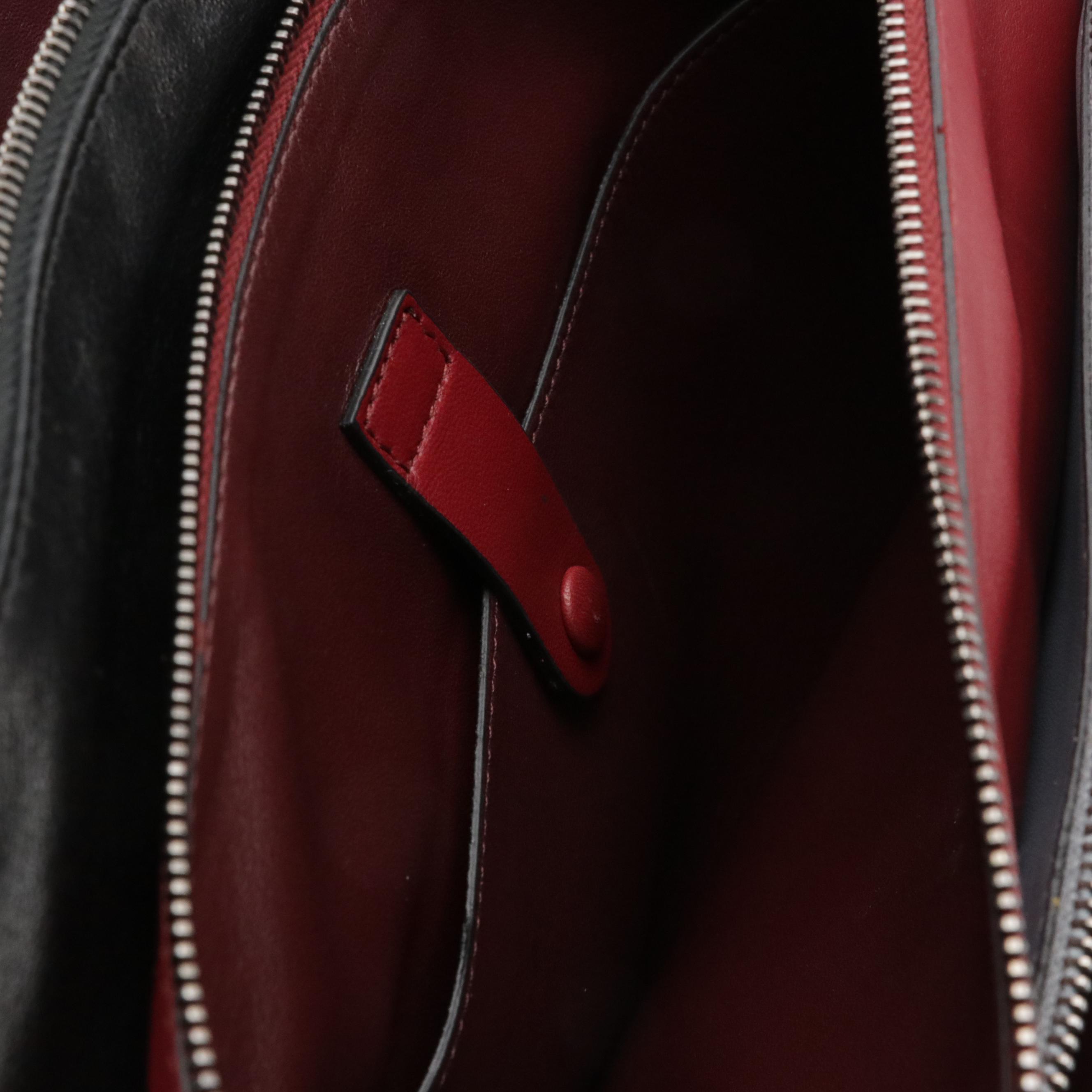 Valentino Garavani Rockstud Triple Zip Clutch in Calfskin Leather