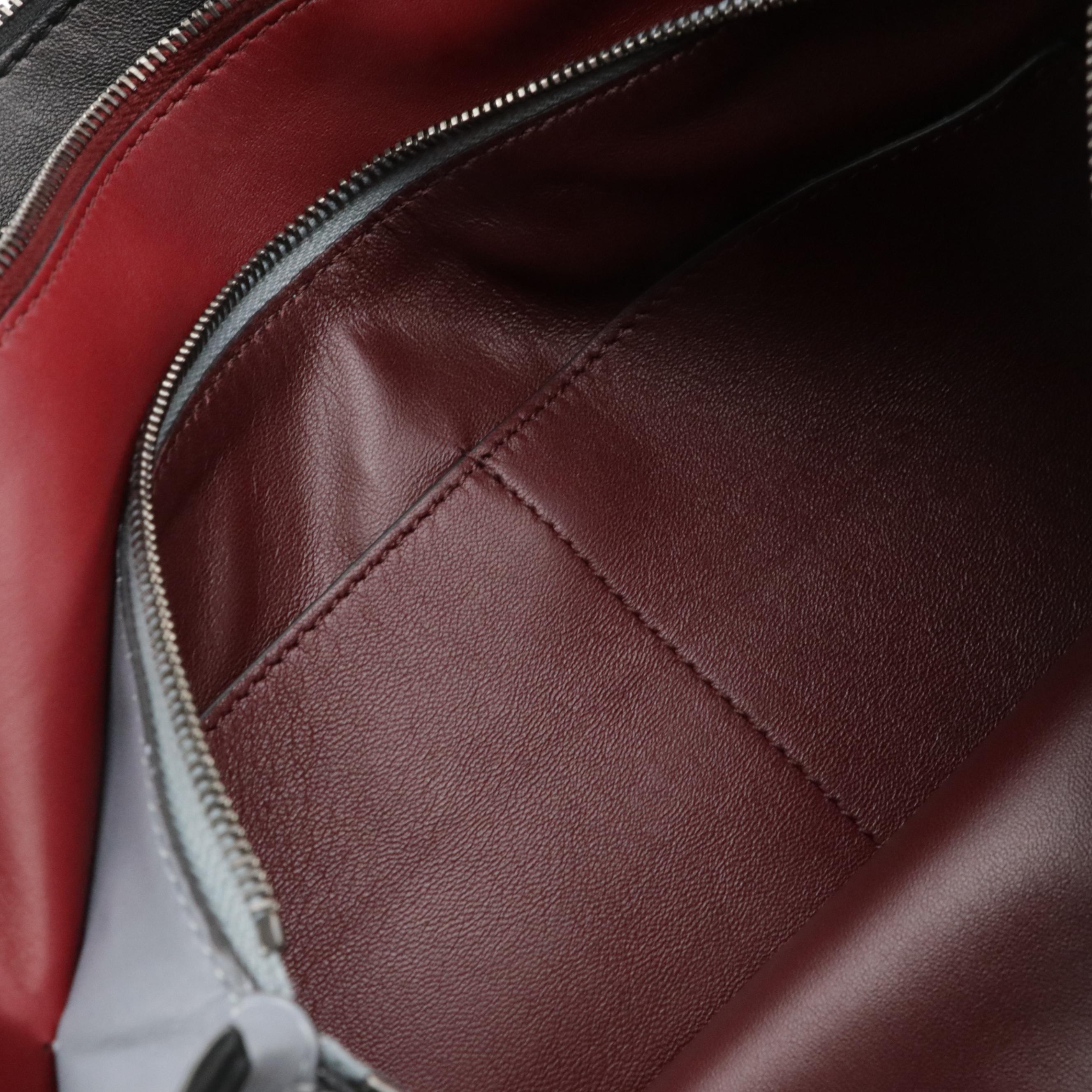 Valentino Garavani Rockstud Triple Zip Clutch in Calfskin Leather