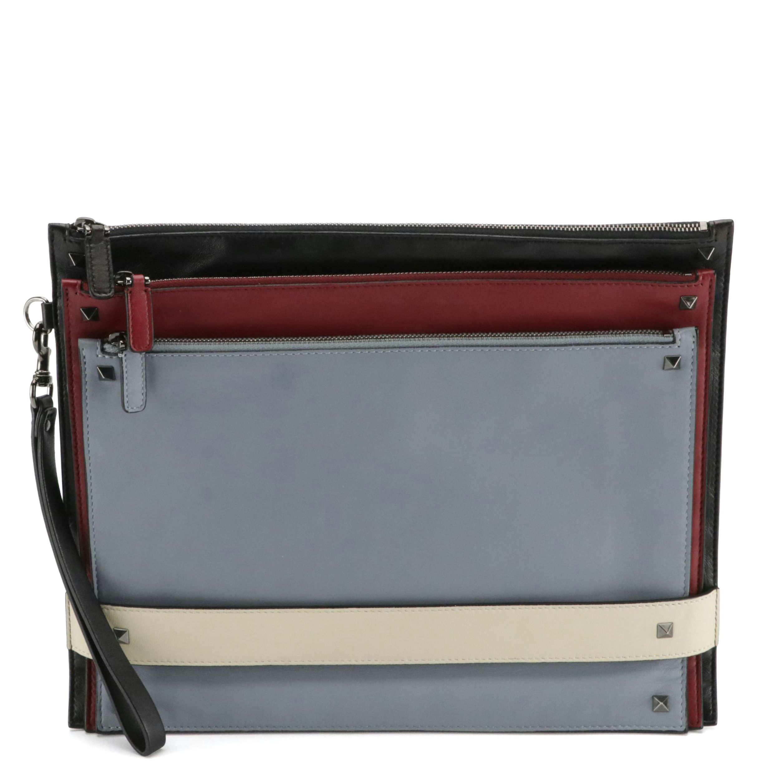 Valentino Garavani Rockstud Triple Zip Clutch in Calfskin Leather