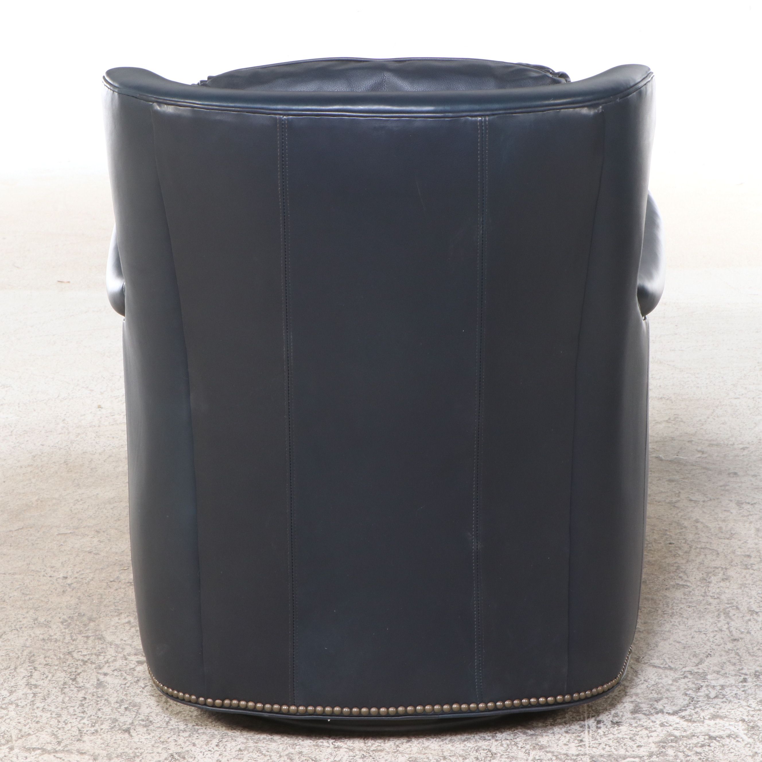 Pair of Ohio Hardwood Furniture Leather Upholstered Swivel Armchairs