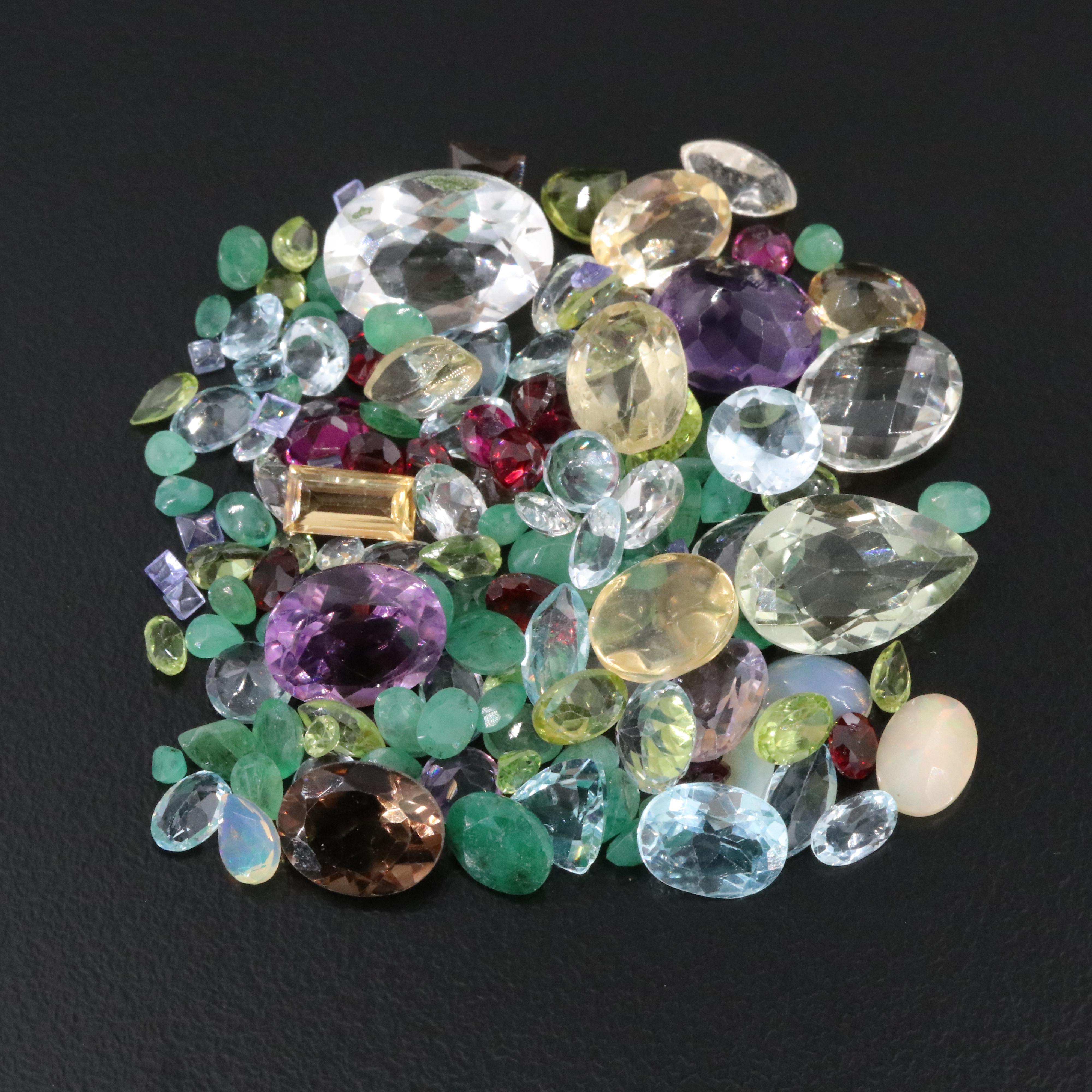 Loose 78.23 CTW Gemstone Lot Including Amethyst, Emerald and Garnet