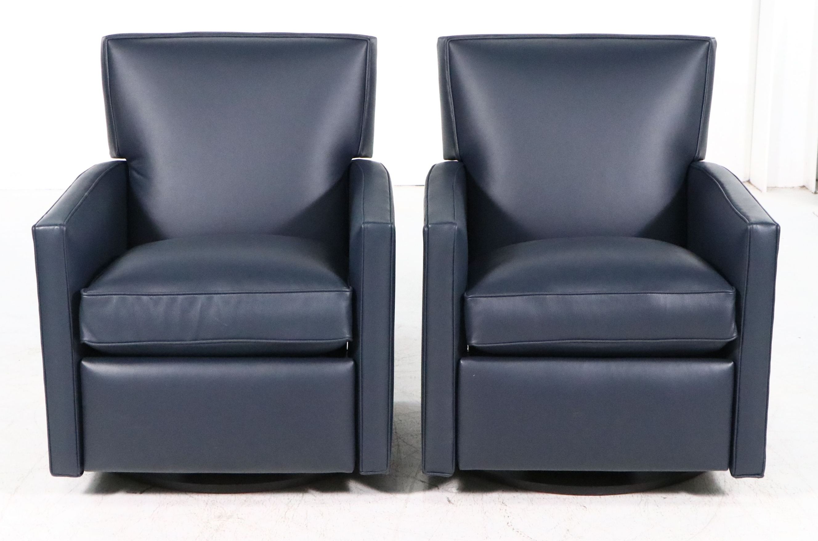 Pair of Arhaus "Tribeca Navy" Leather Upholstered Swivel Recliners