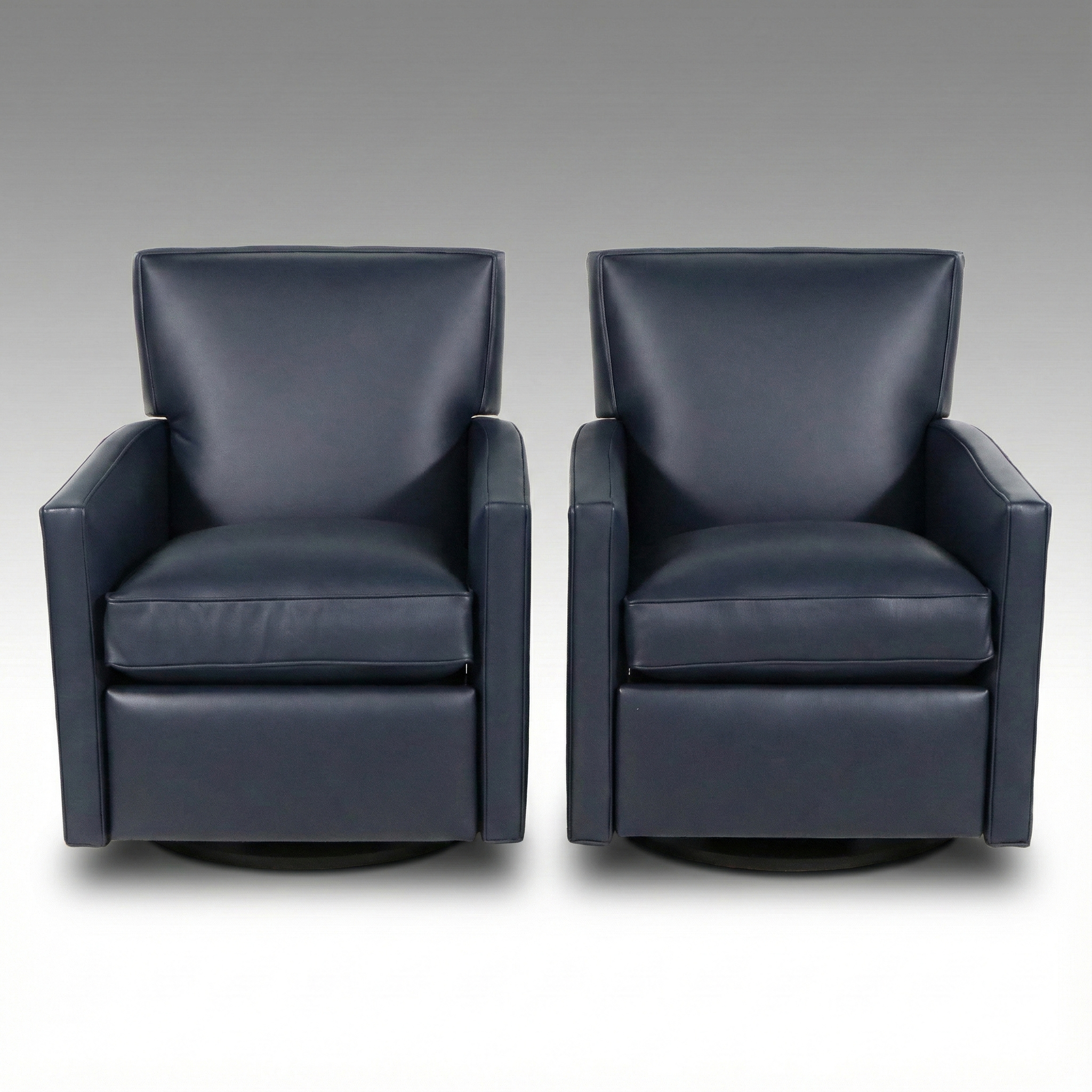 Pair of Arhaus "Tribeca Navy" Leather Upholstered Swivel Recliners