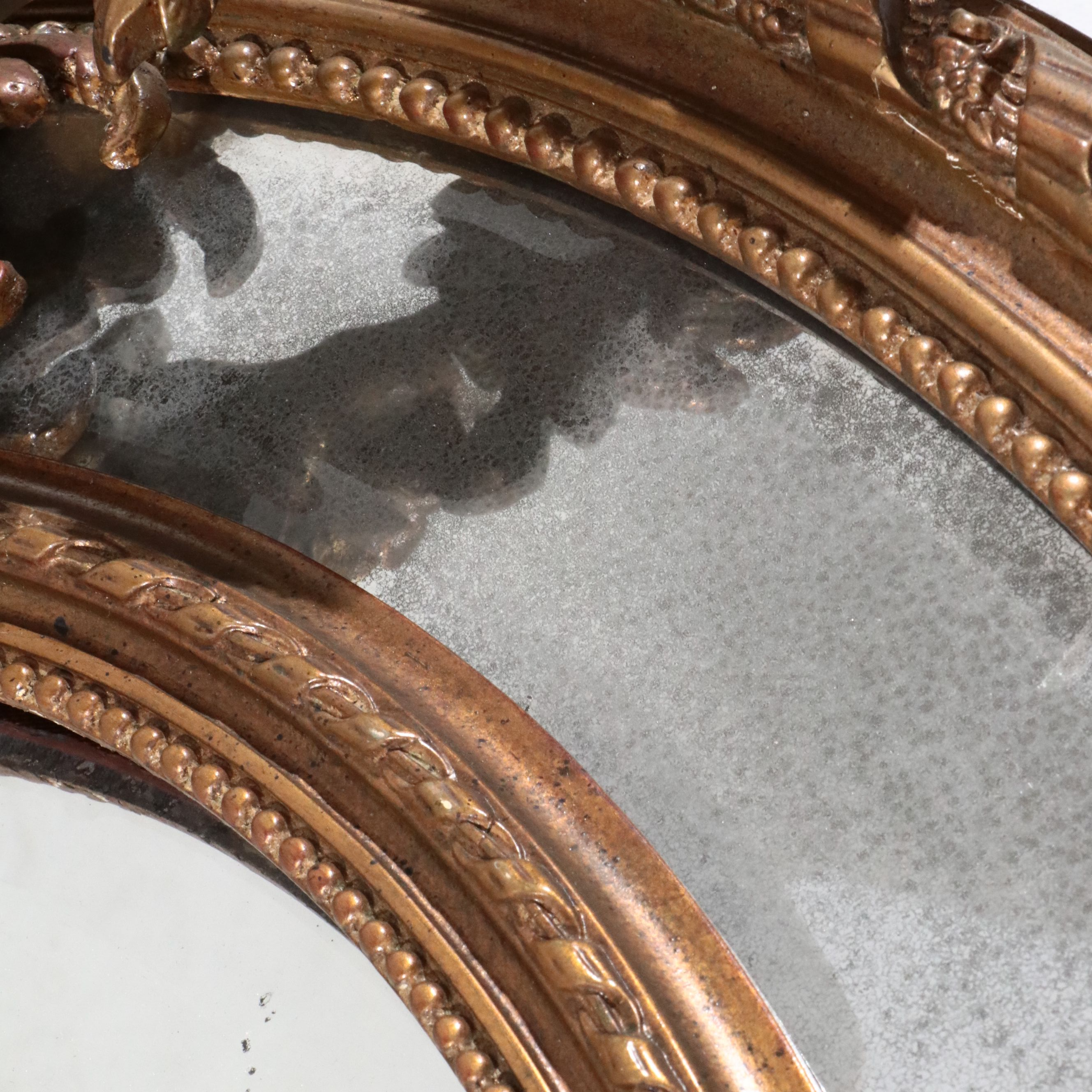 Napoleon III Carved Giltwood Oval Marginal Mirror, Late 19th Century