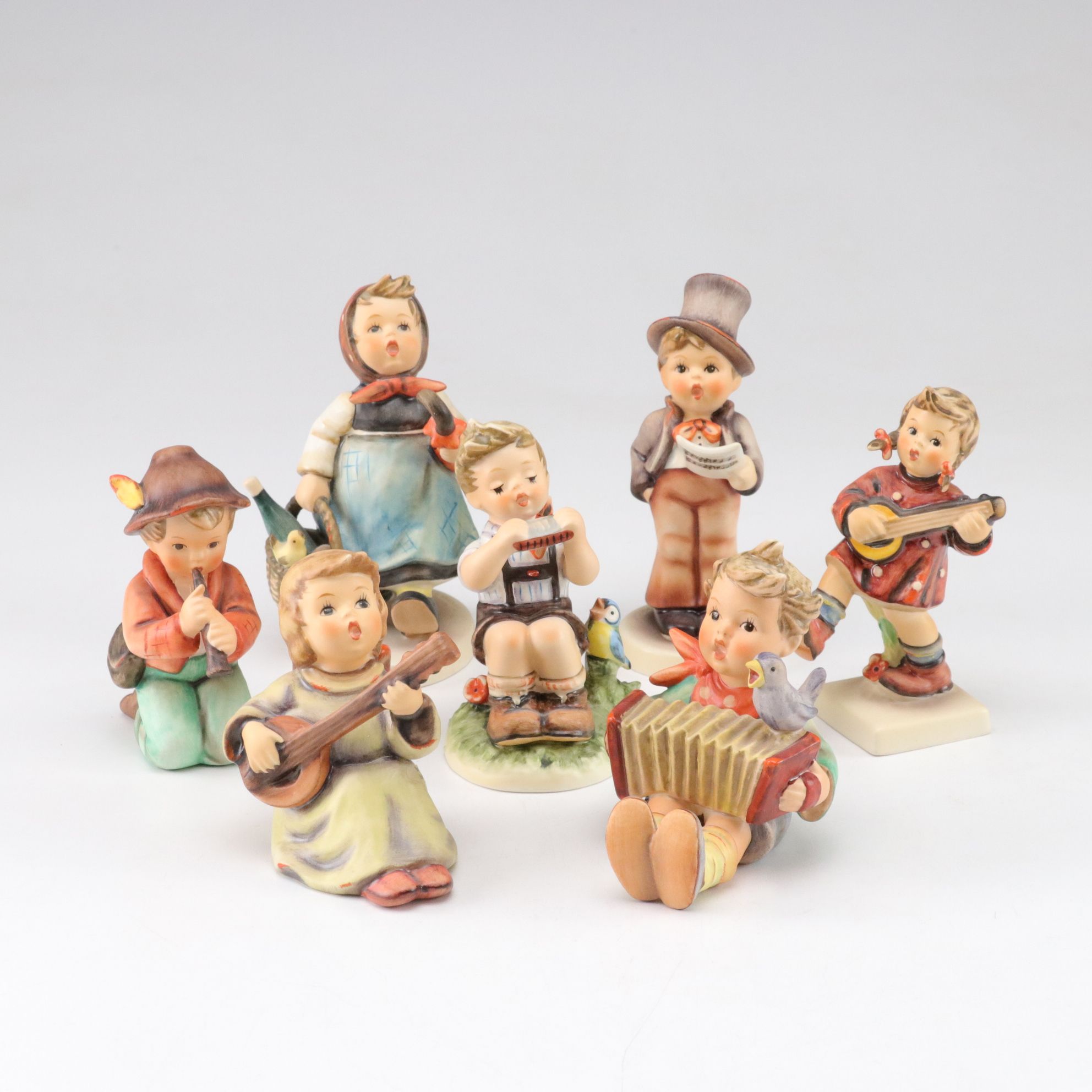 Goebel "Street Singer" and Other Porcelain Hummel Figurines