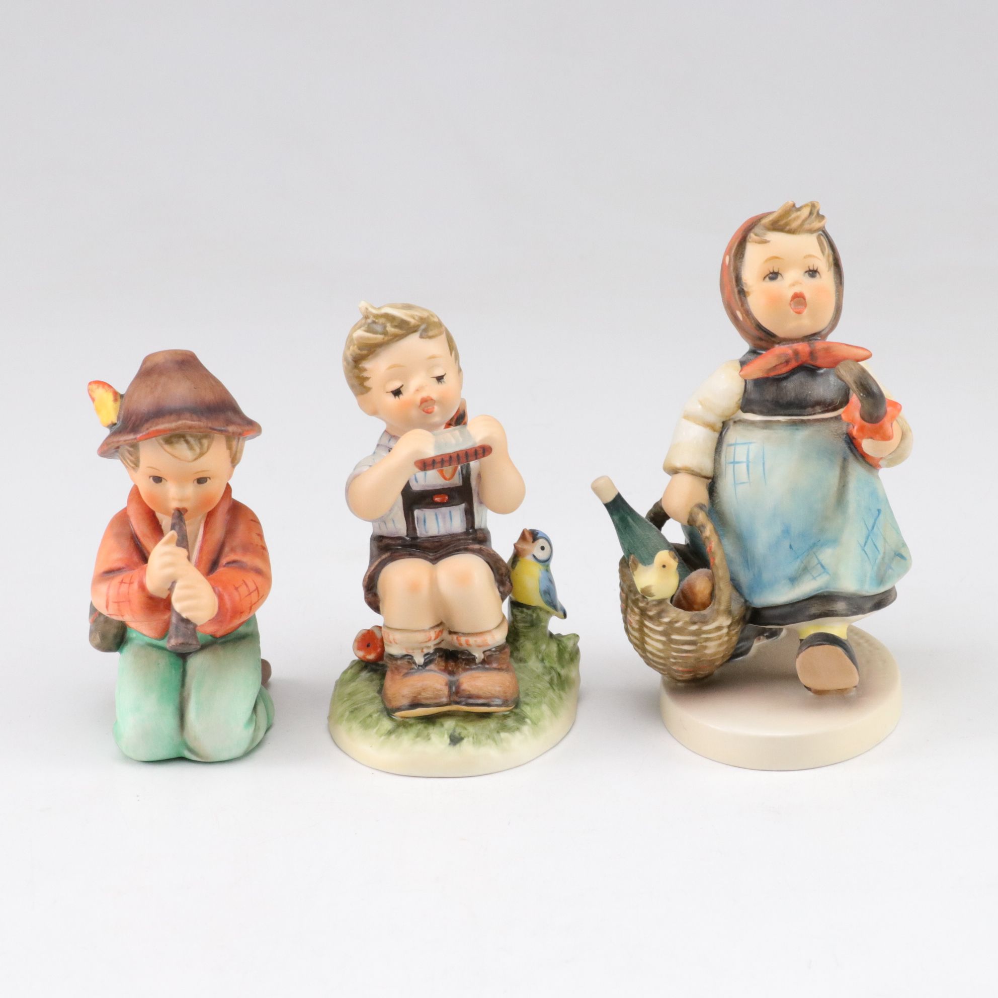 Goebel "Street Singer" and Other Porcelain Hummel Figurines