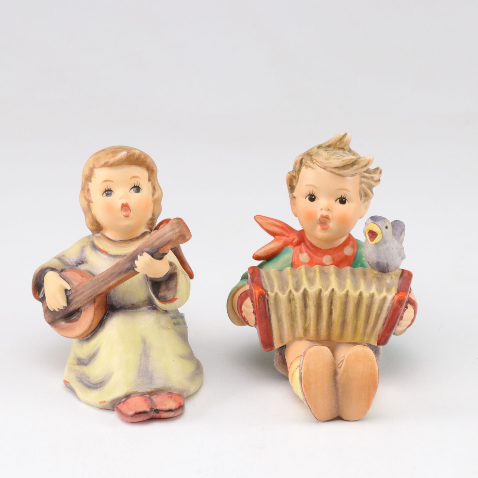 Goebel "Street Singer" and Other Porcelain Hummel Figurines
