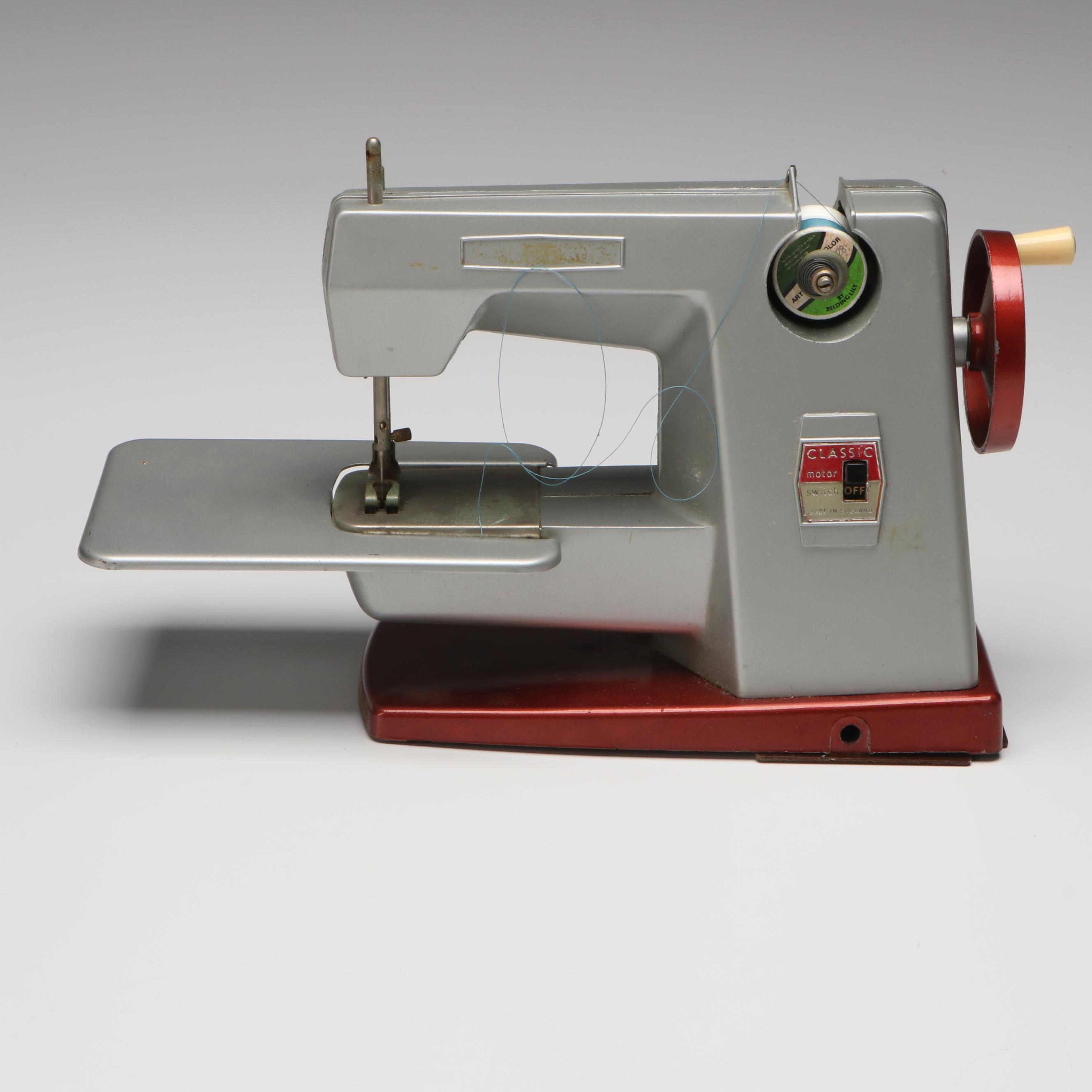 Vulcan Battery Powered Sewing Machine with Tin of Buttons and Pincushion