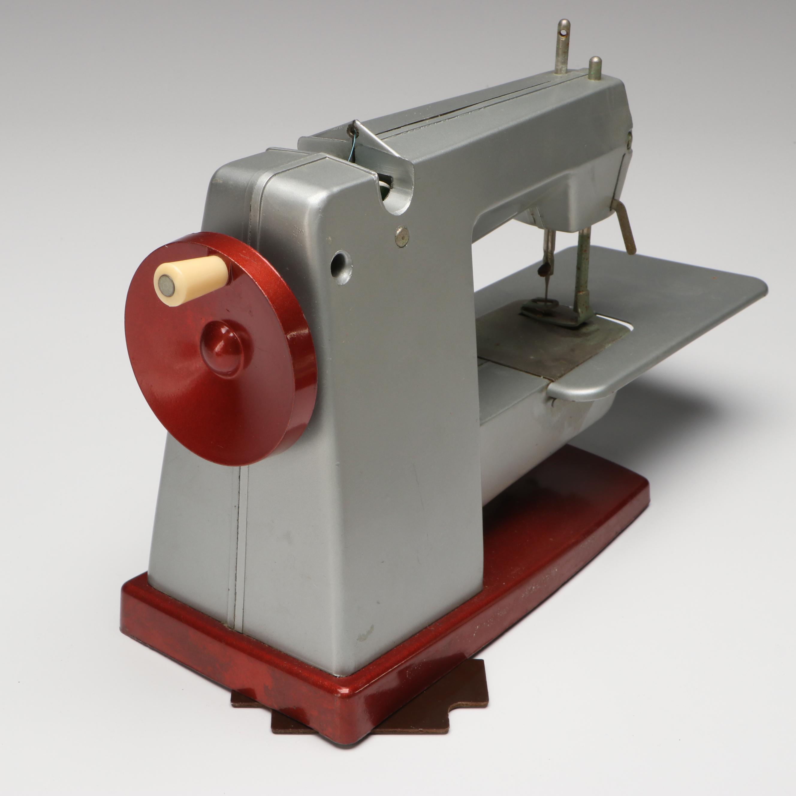 Vulcan Battery Powered Sewing Machine with Tin of Buttons and Pincushion